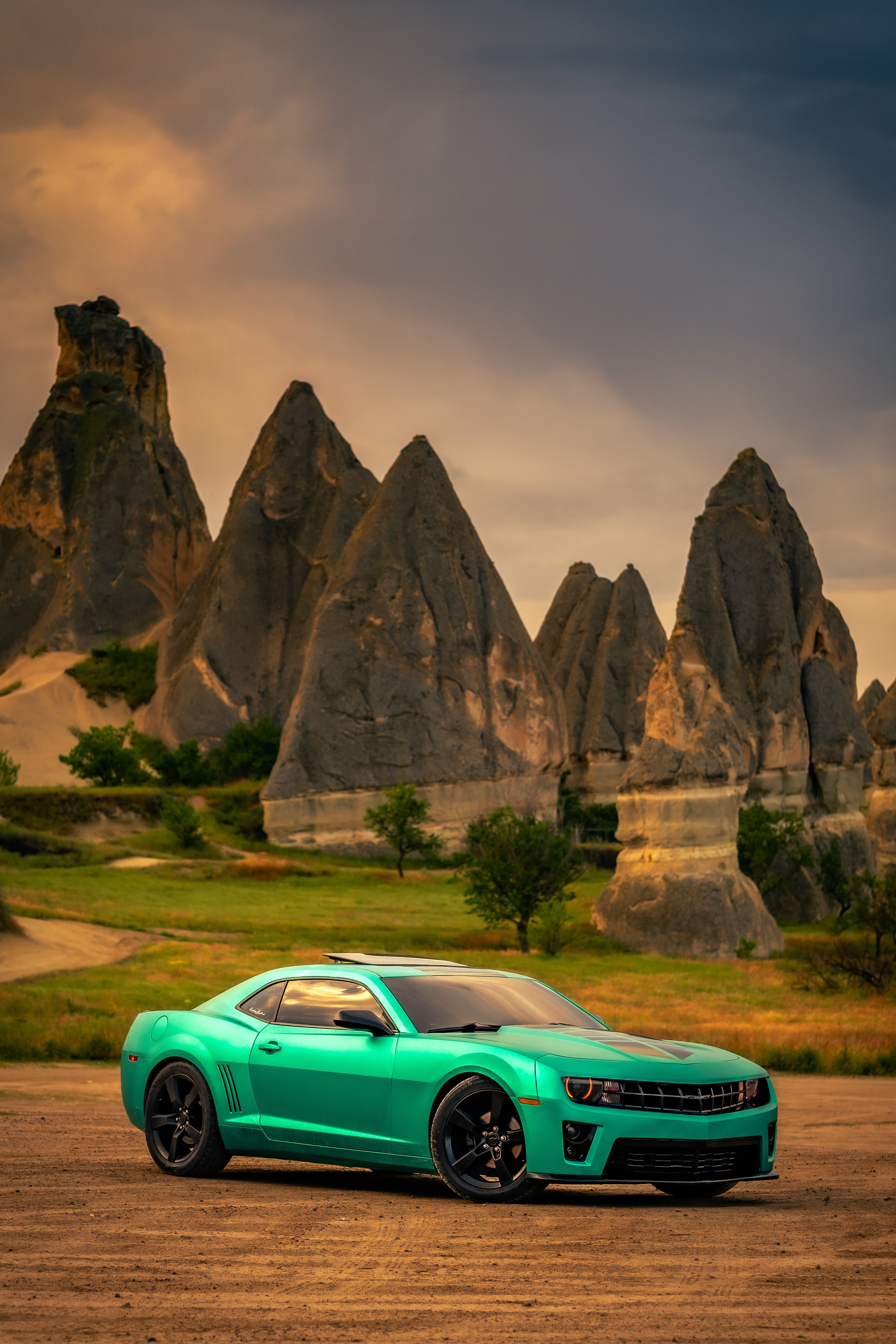 A Modern Chevrolet Camaro on the Background of Rock Formations in Cappadocia, Turkey · Free
