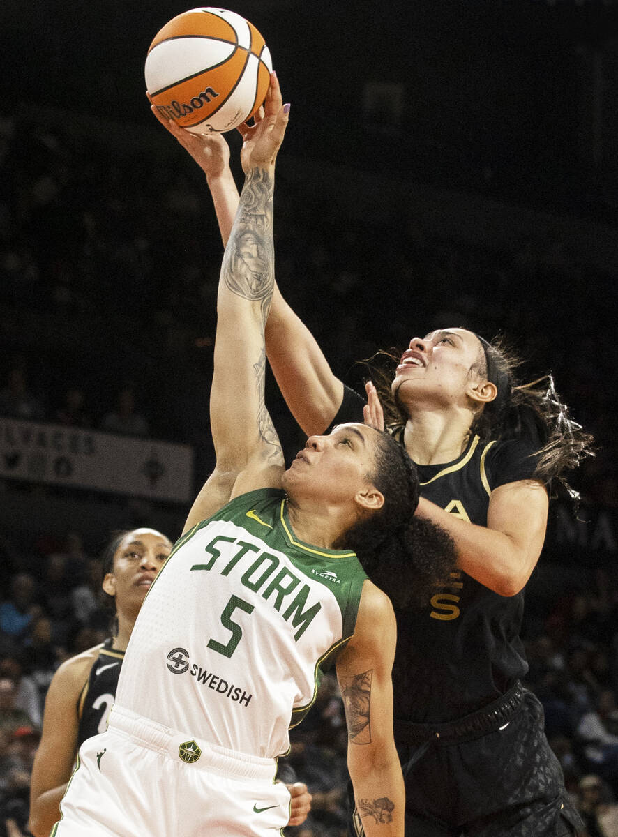 Aces Forward Dearica Hamby Fights For A Rebound With Seattle Storm's Gabby Williams. Las Vegas Review Journal