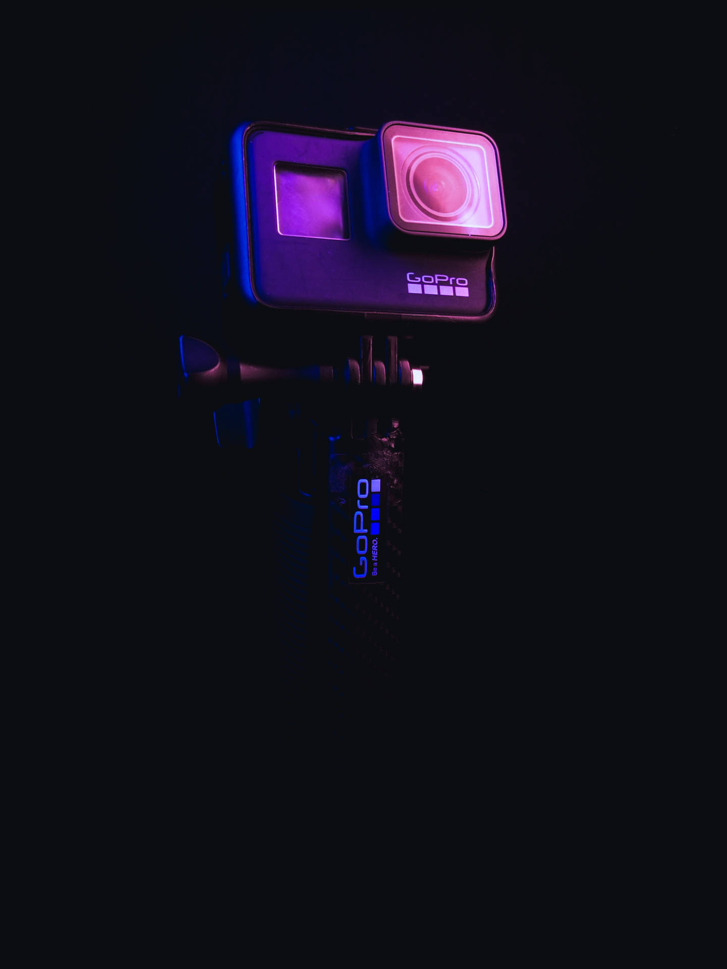 Download GoPro In Neon Purple Light Wallpaper