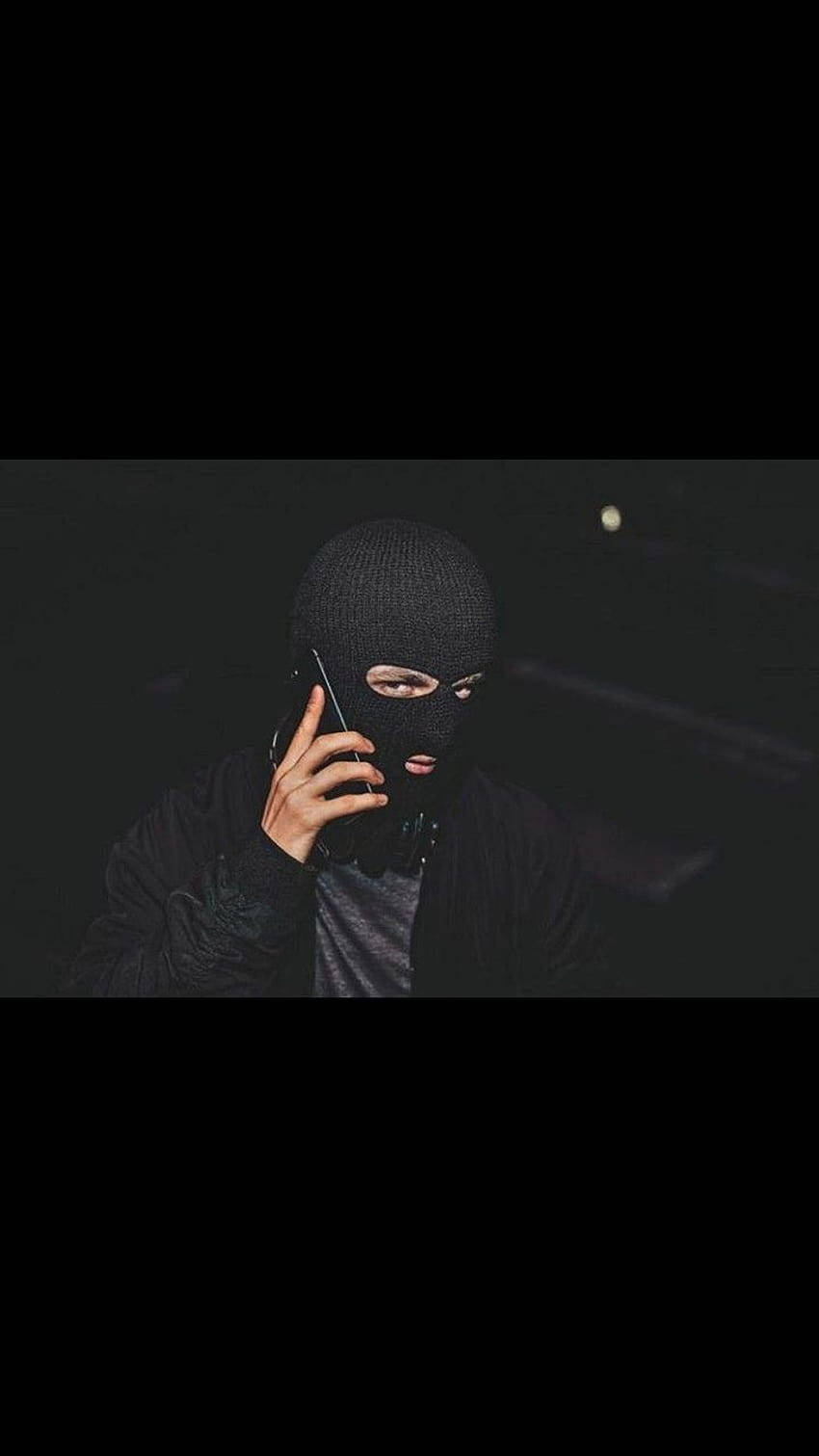 Download A black ski mask obscures the identity of the wearer. Wallpaper