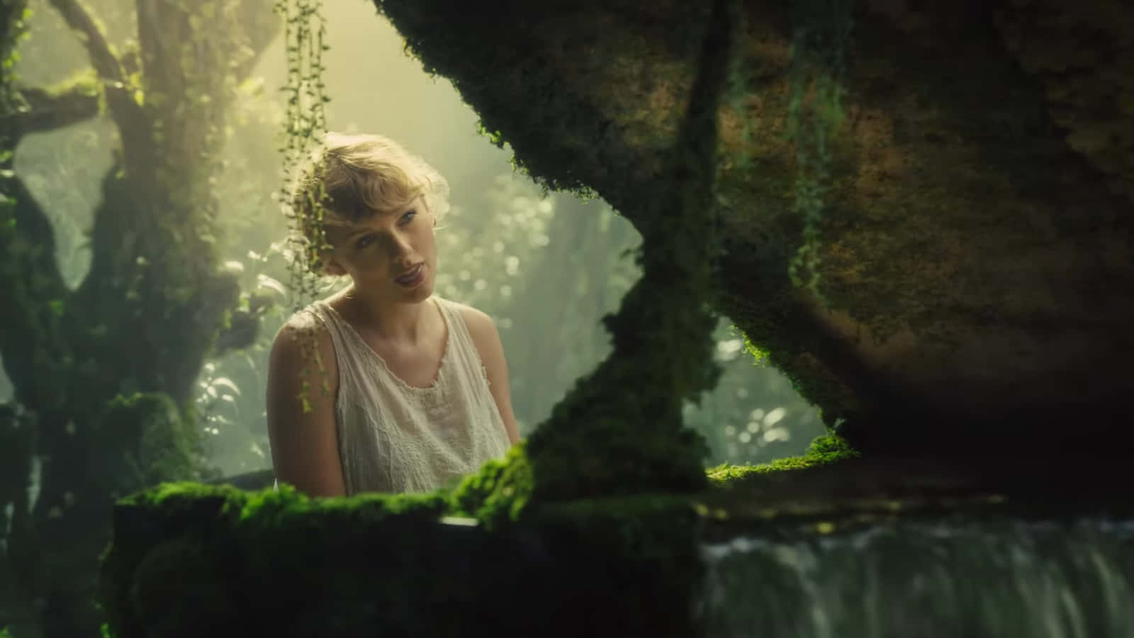 Download Taylor Swift looks into the camera during the recording of ' Folklore', an album she released in 2020 Wallpaper