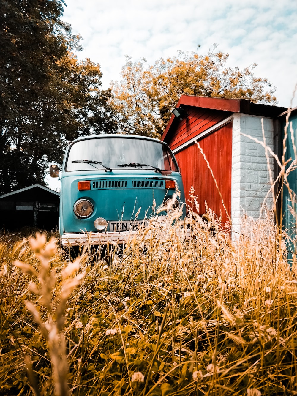 Blue Volkswagen T1 parked near house photo