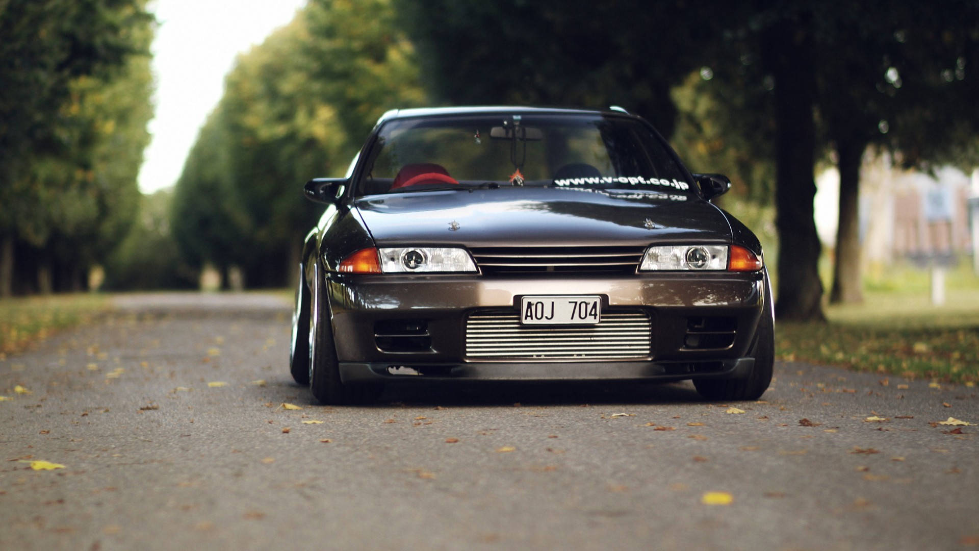 Download Classic Beauty: Vintage Black Skyline Car Wallpaper