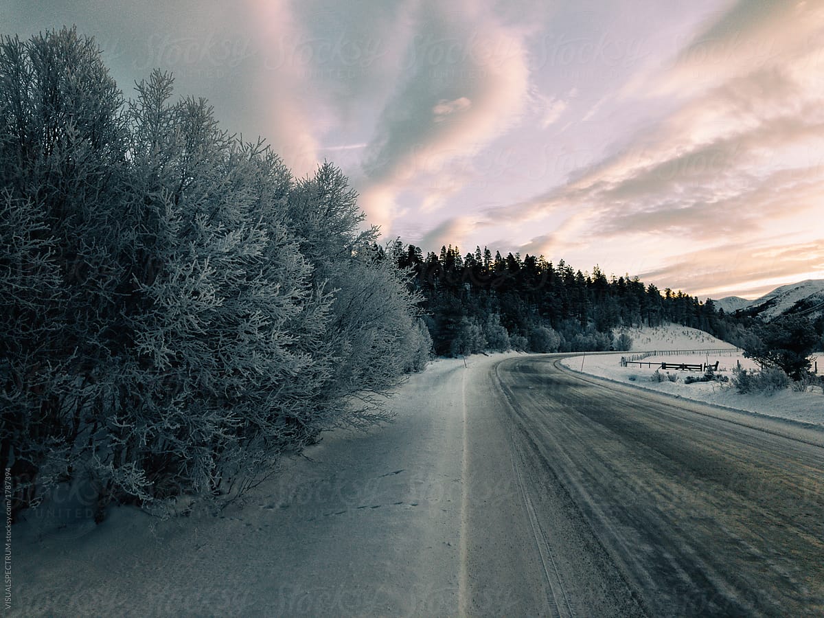 Moody Winter Driving In Rural Norway- Stocksy