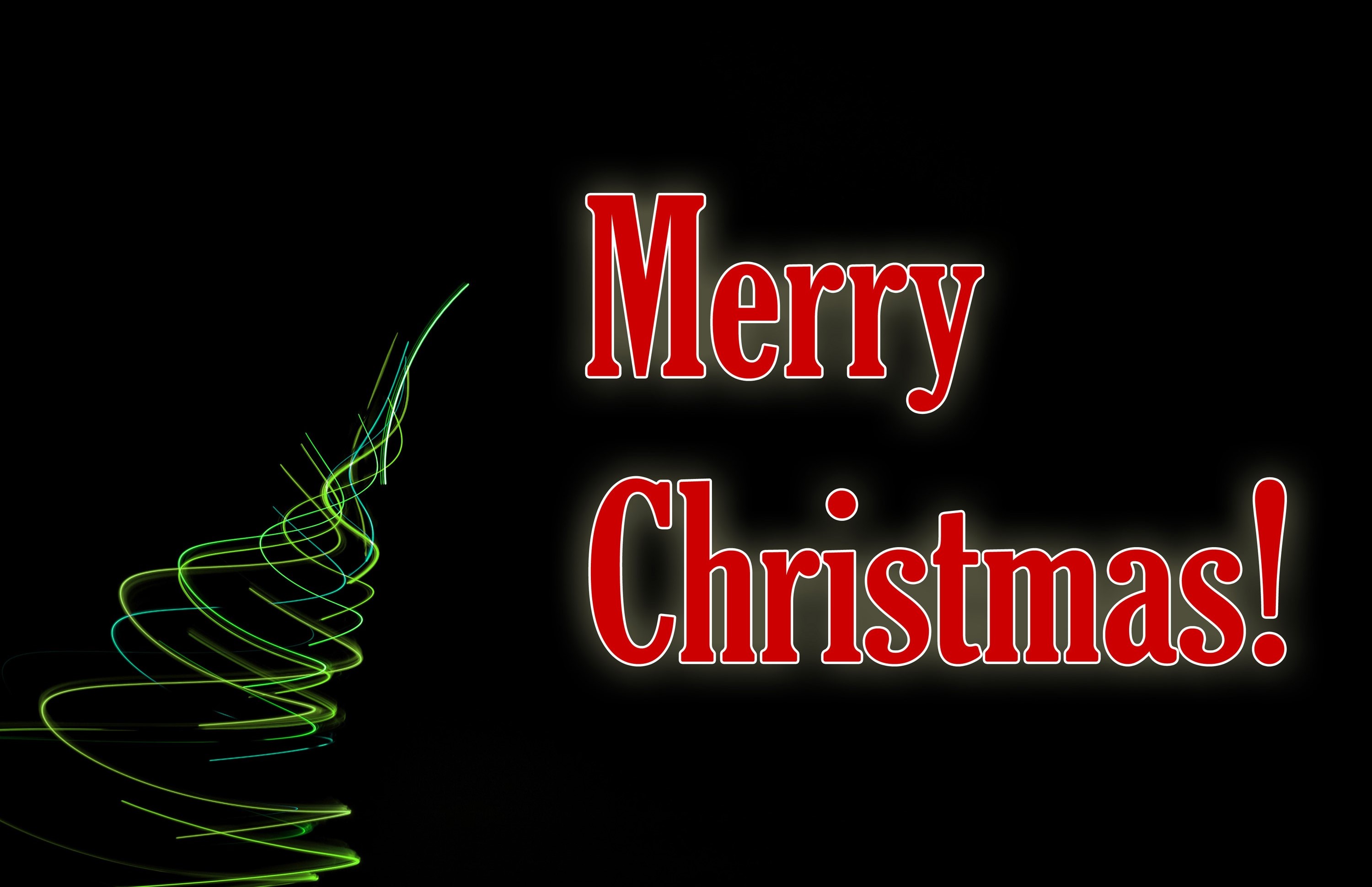 Photo of Merry Christmas light on a dark background. Free christmas image