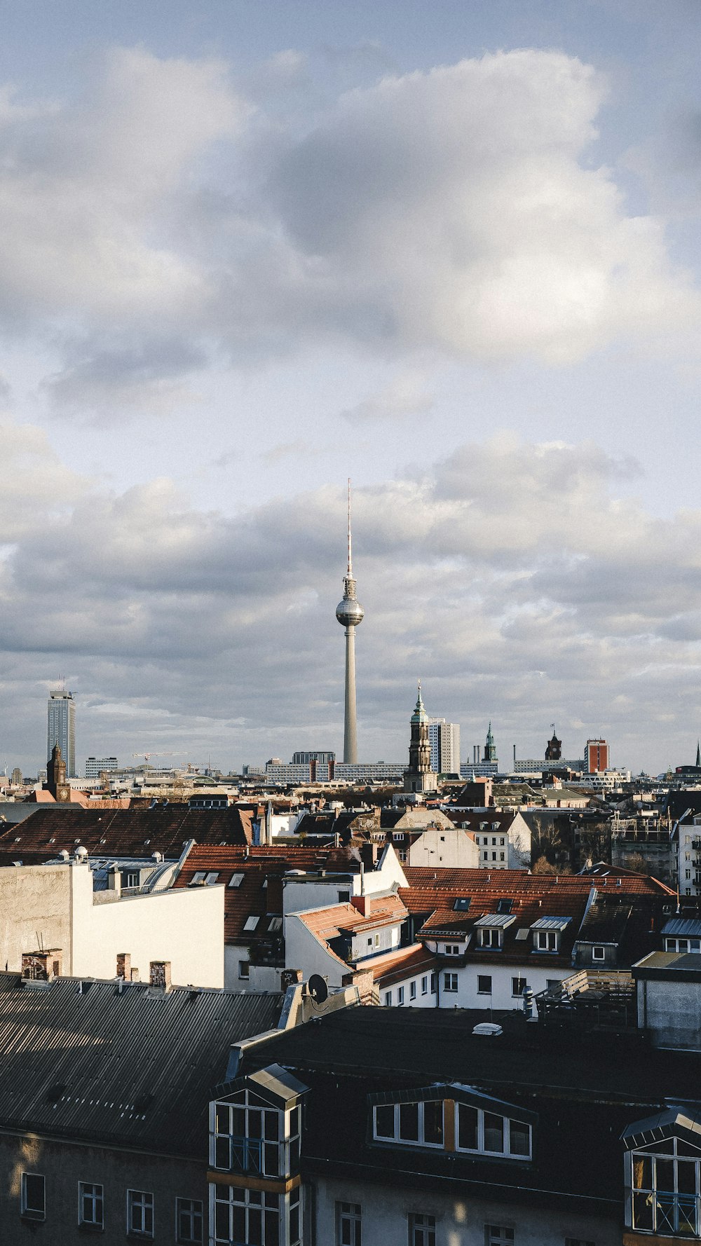 A view of a city skyline with a tower in the background photo