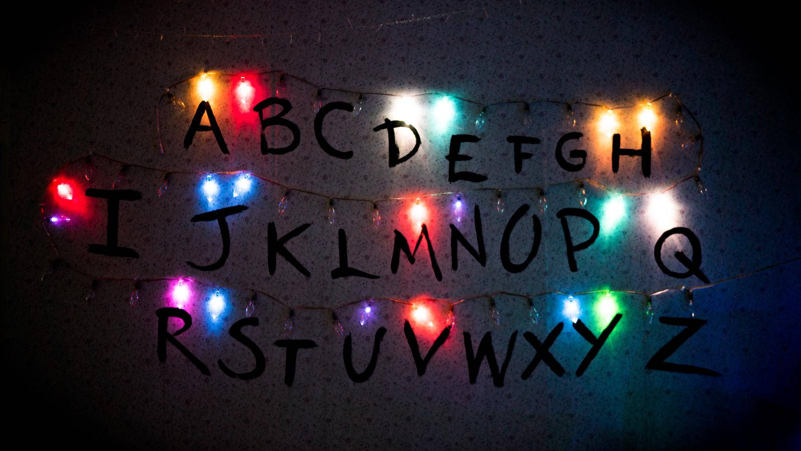Download Understand The Upside Down With This Alphabet Of Lights From Stranger Things Wallpaper