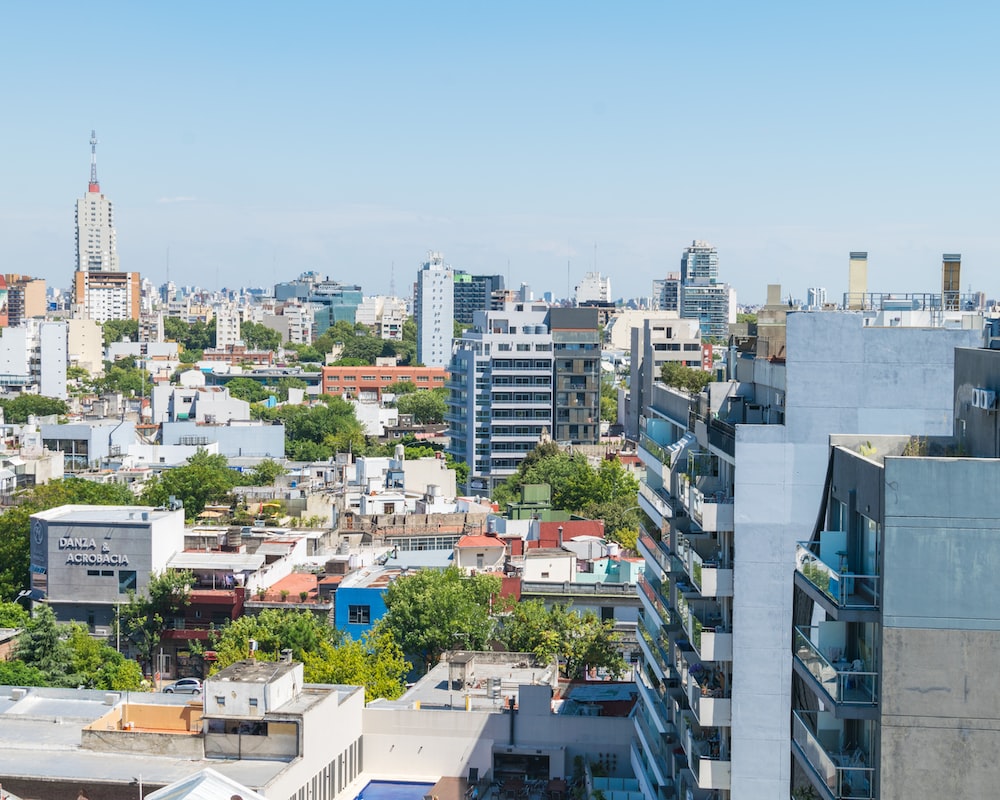 City buildings under blue sky during daytime photo