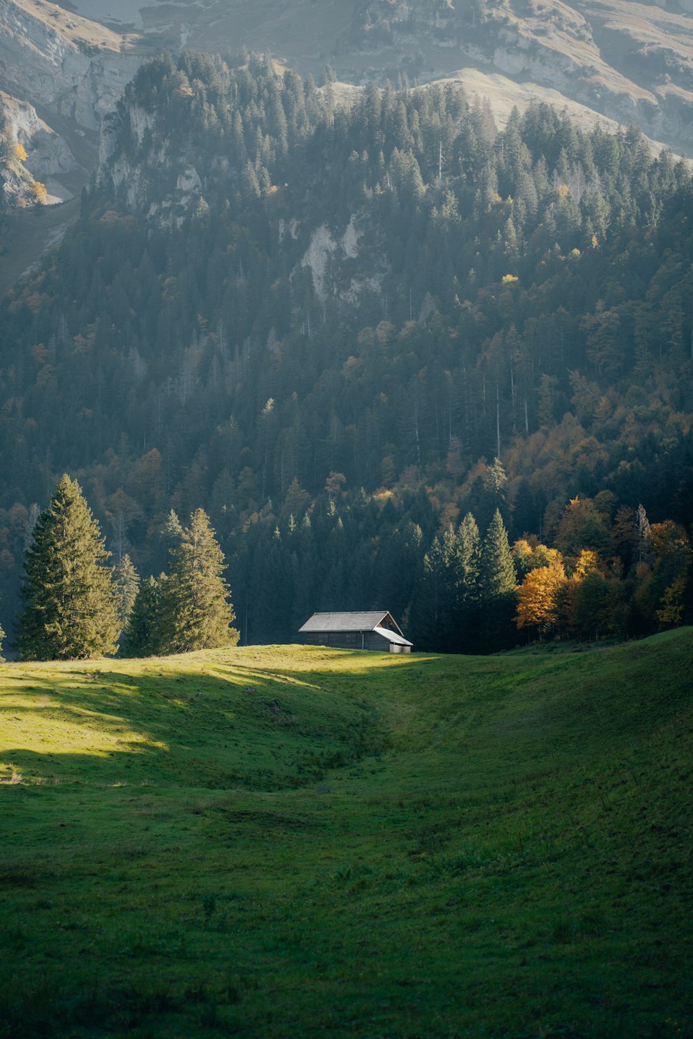 A house in a valley between mountains photo