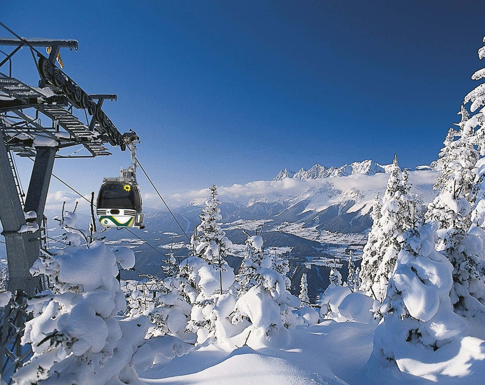 Download Conquer the slopes and embrace the stunning beauty of the ski mountain Wallpaper