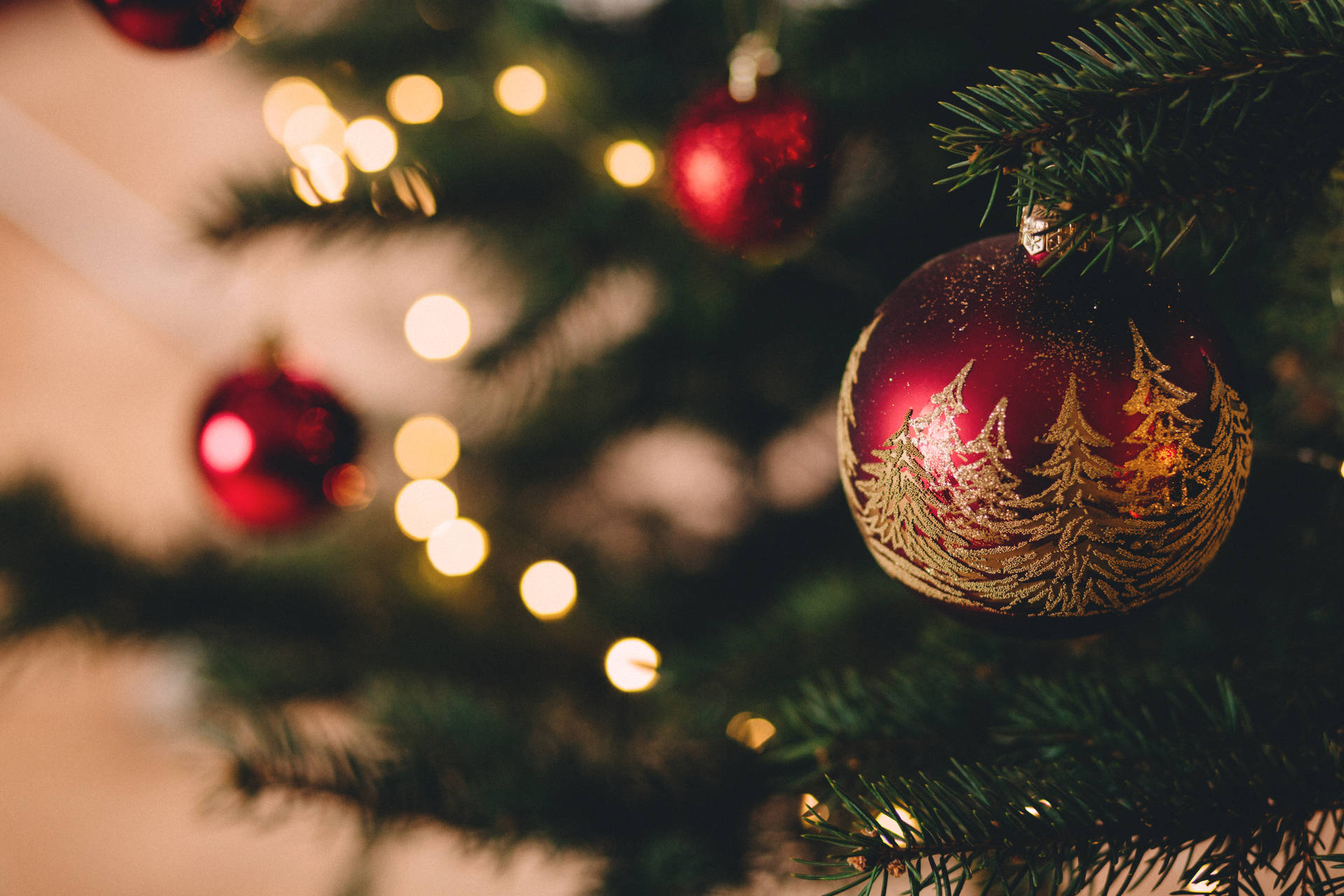Download A Bright Red Christmas Ball to Get You in the Holiday Spirit! Wallpaper