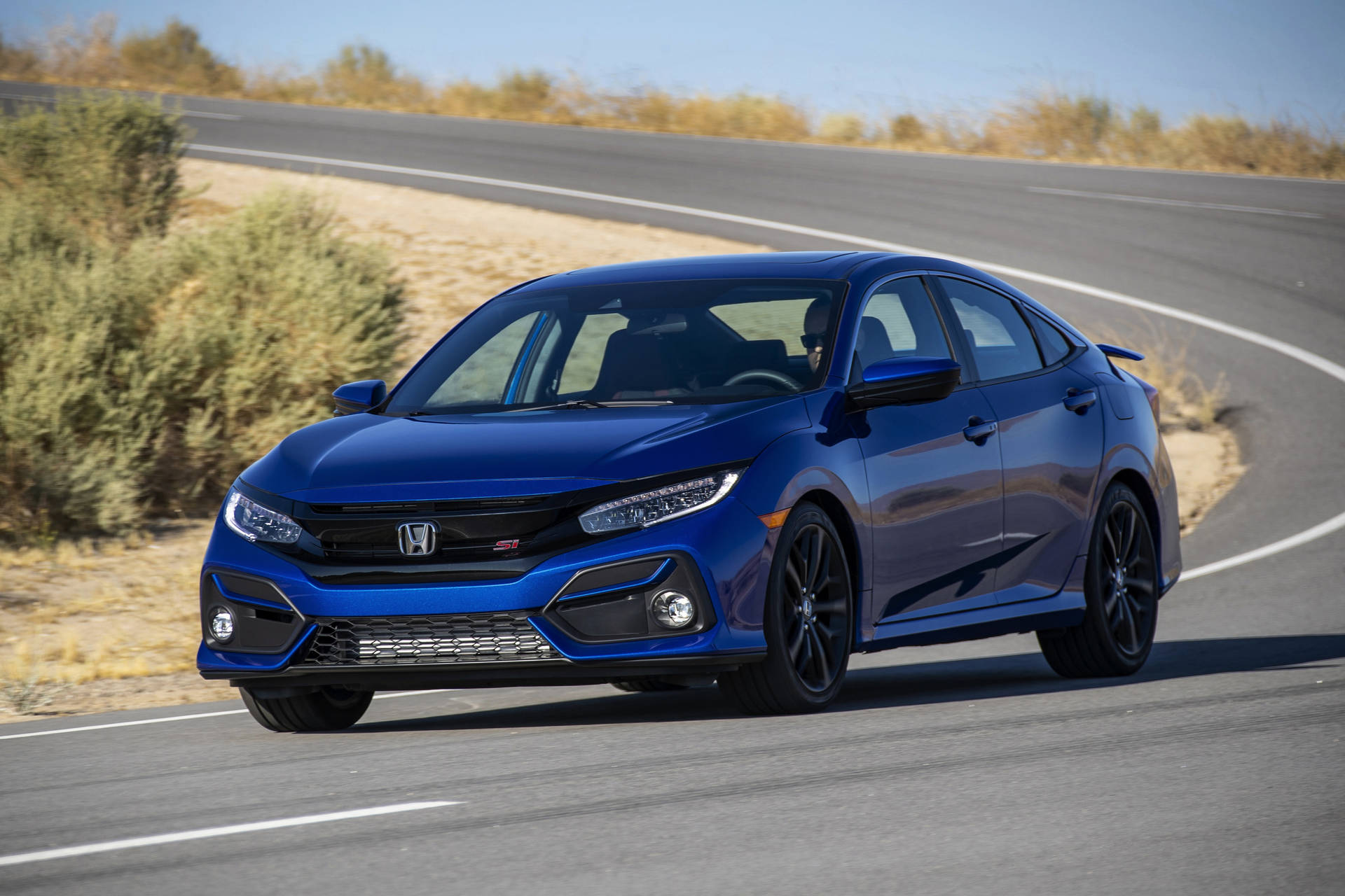 Download Stunning Blue 4k Honda Civic Cruising On The Road. Wallpaper