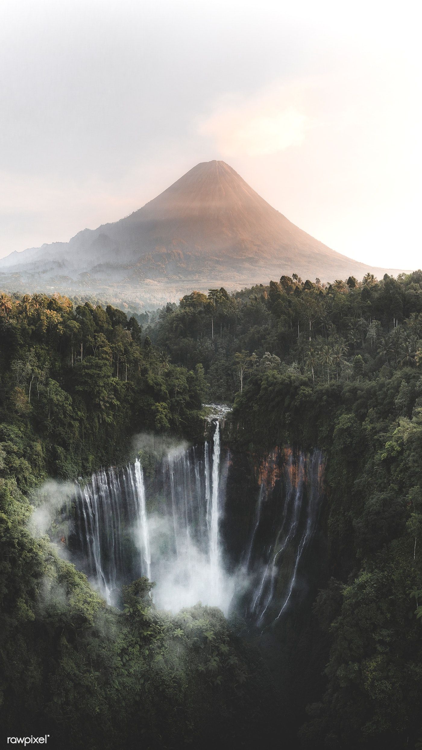 View of Mount Bromo and Tumpak Sewu Waterfalls, Indonesia mobile phone wallpaper. premium image / Luke. Waterfall, Landscape photography, Scenery