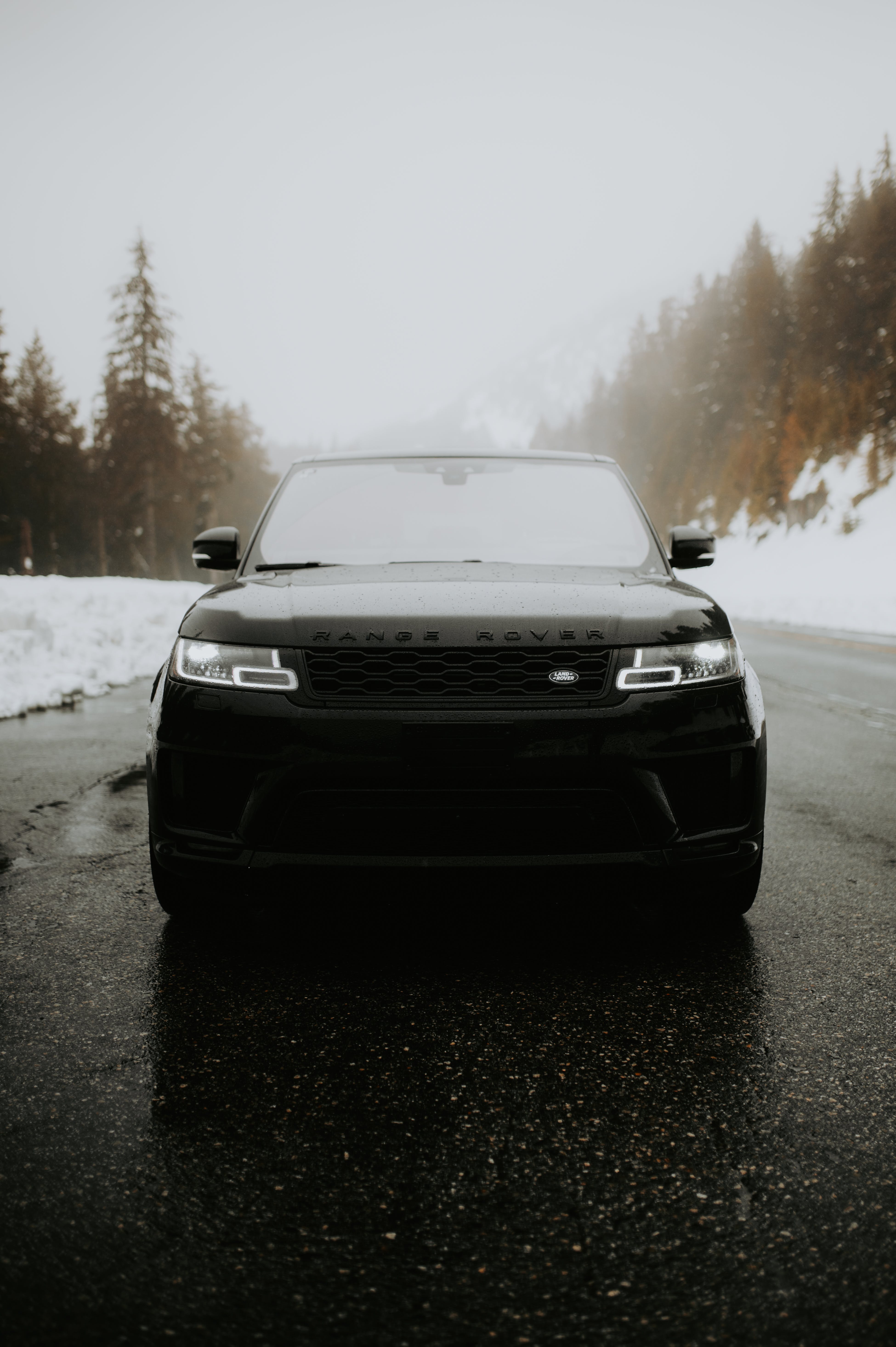 A Black Range Rover on an Asphalt Road in Winter · Free