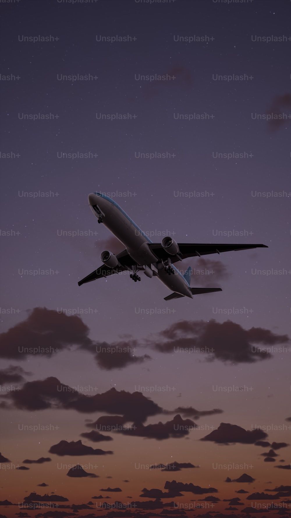 An airplane is flying in the sky at night photo