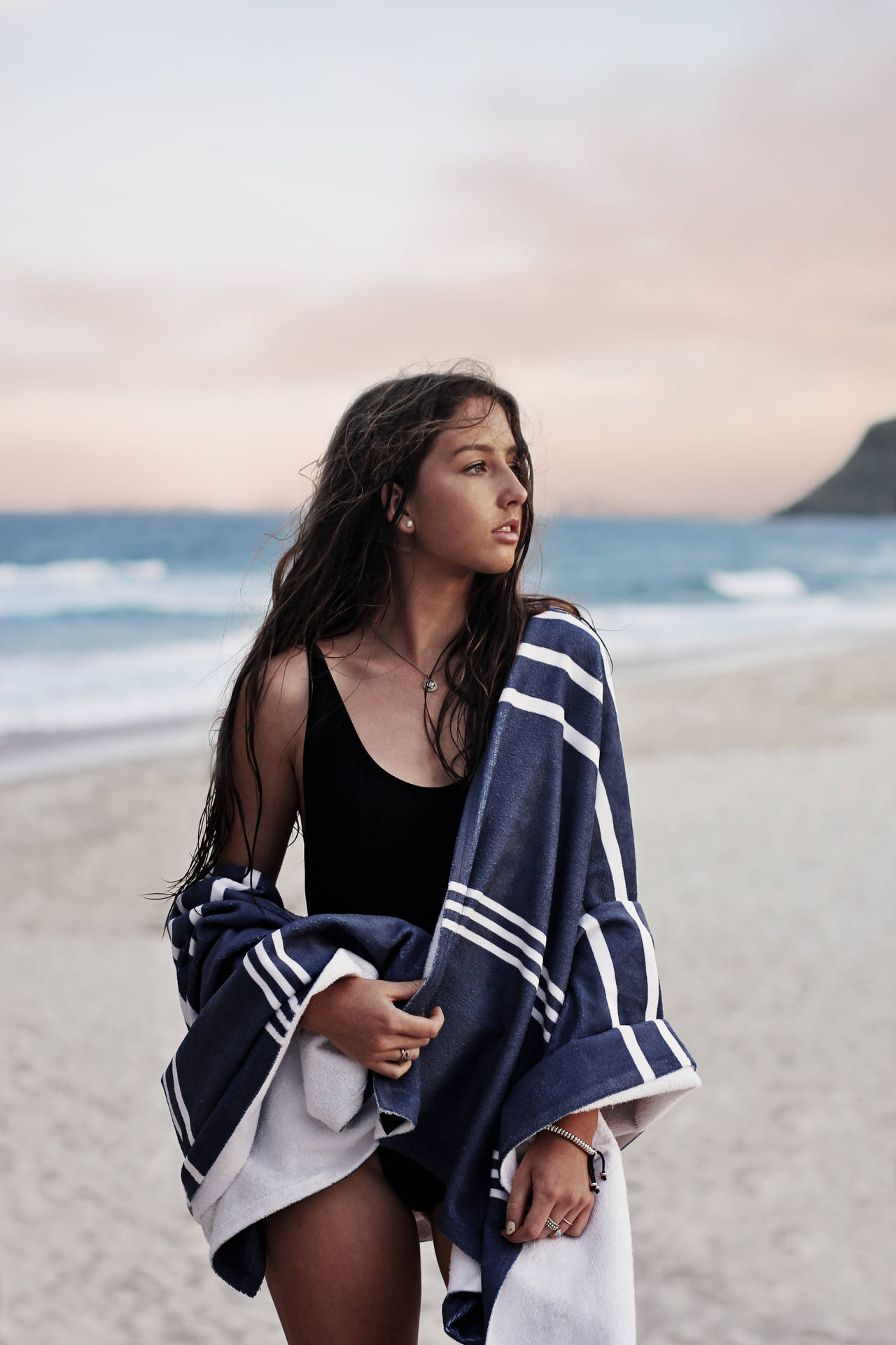 Download A Girl on the Beach Enjoying the Sun Wallpaper