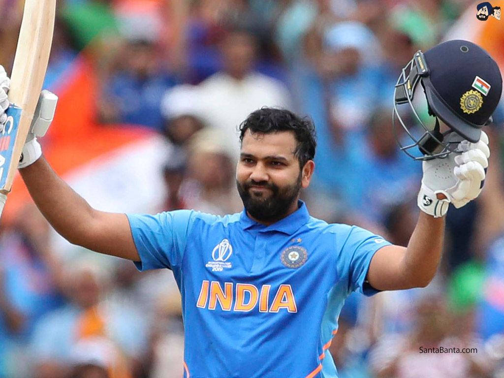 Download Rohit Sharma Smiling For National Team Wallpaper