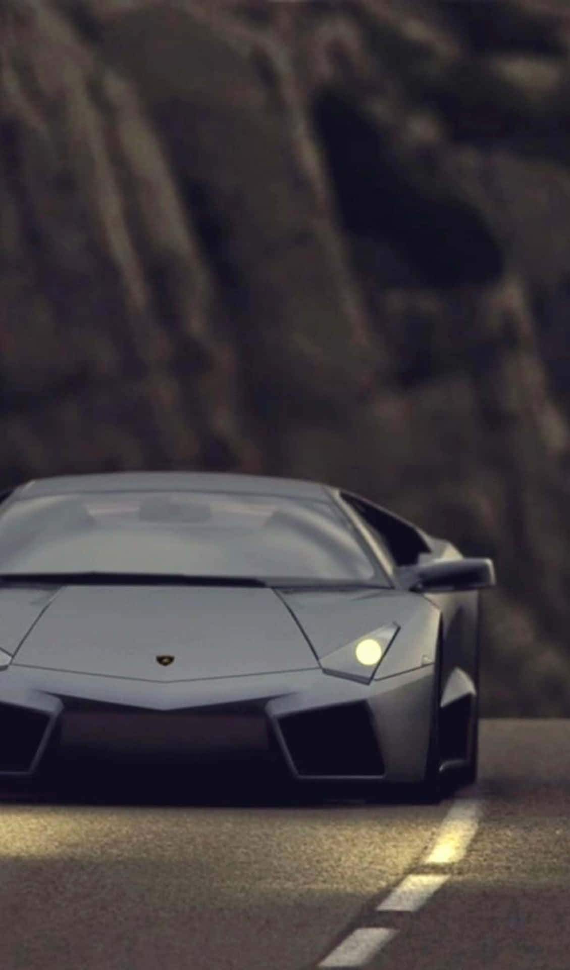 Download The Luxurious Black Lamborghini, a Symbol of Status and Wealth Wallpaper