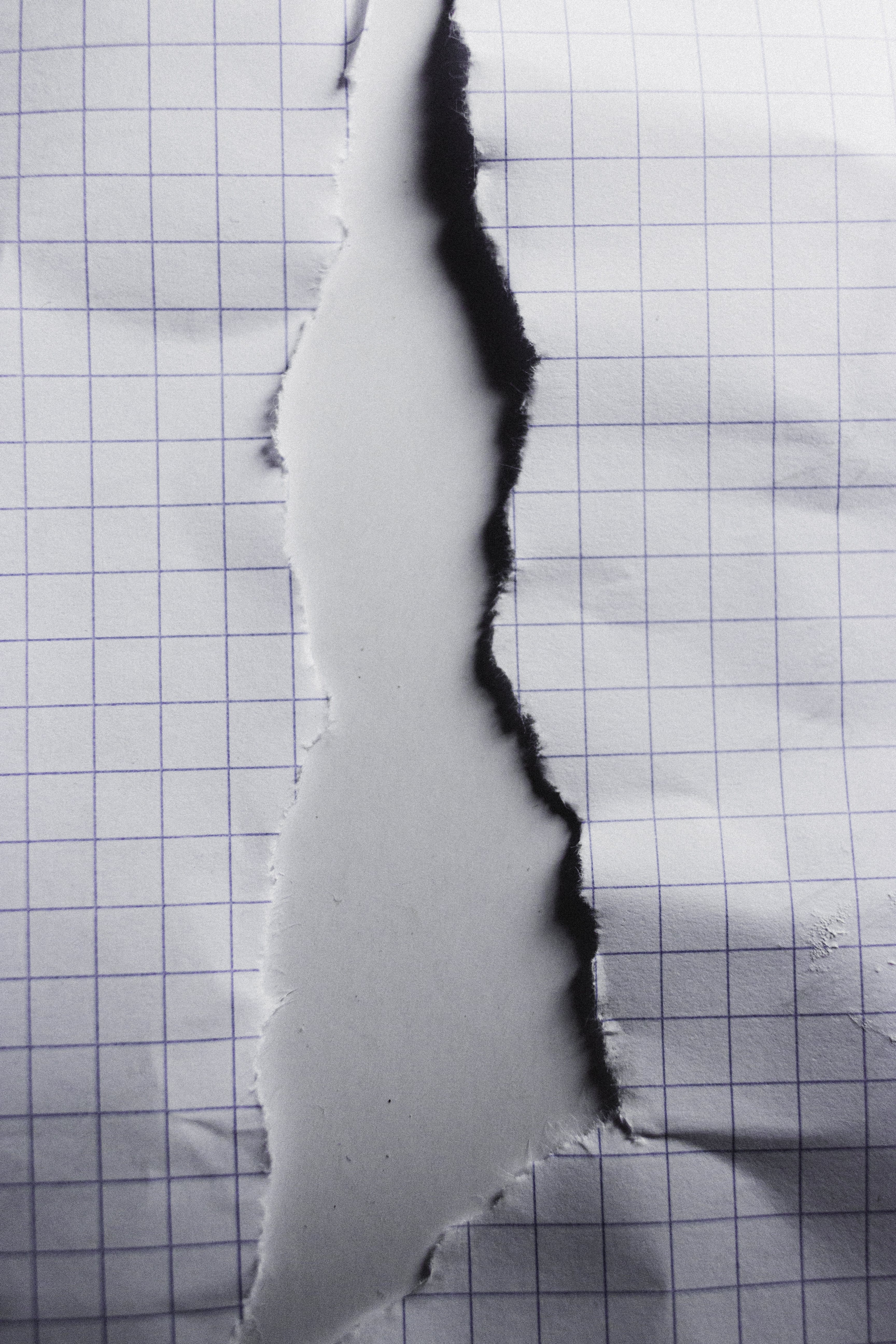 Torn paper with uneven edges on white background · Free