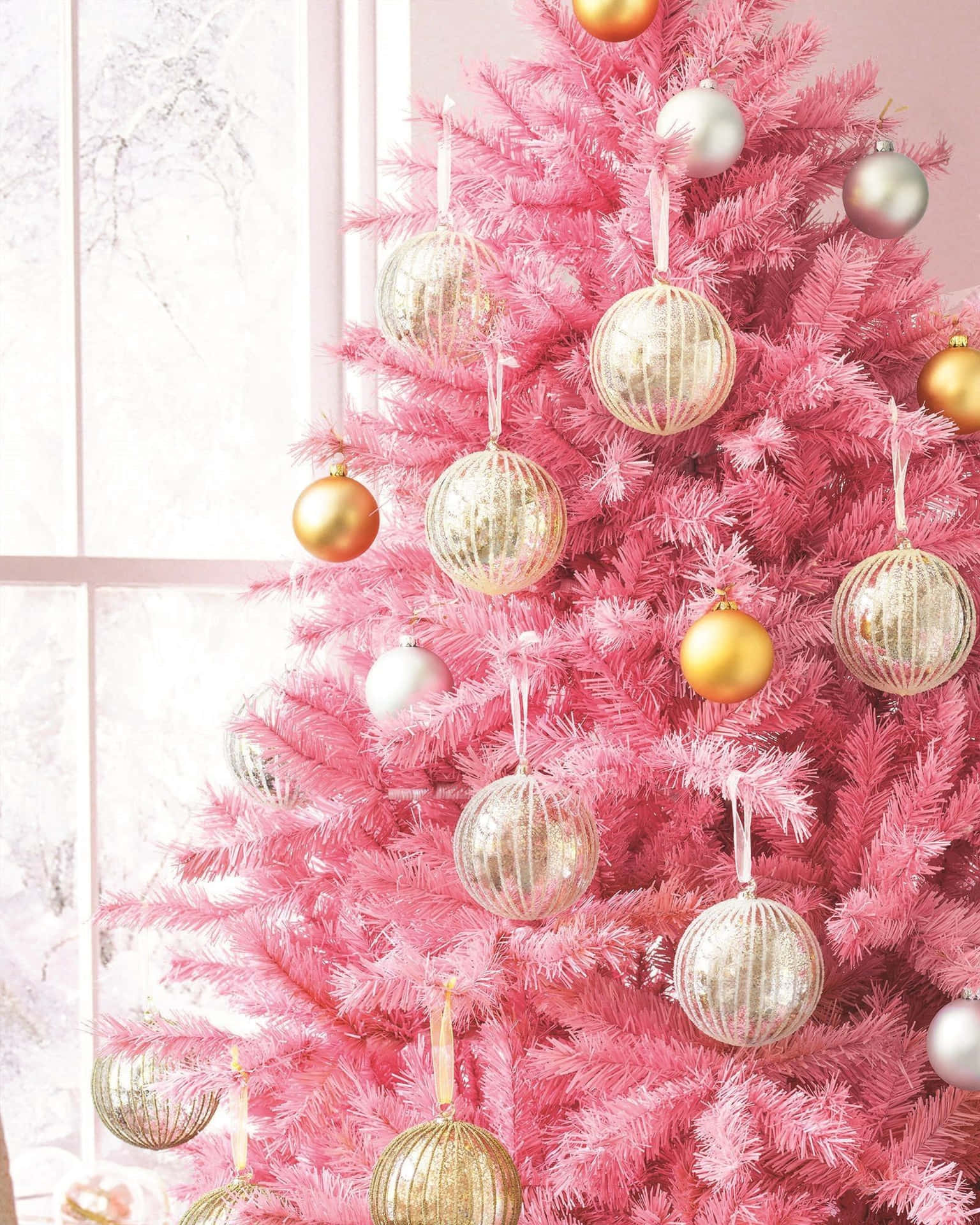 Download Pink Christmas Tree With Gold Ornaments Wallpaper