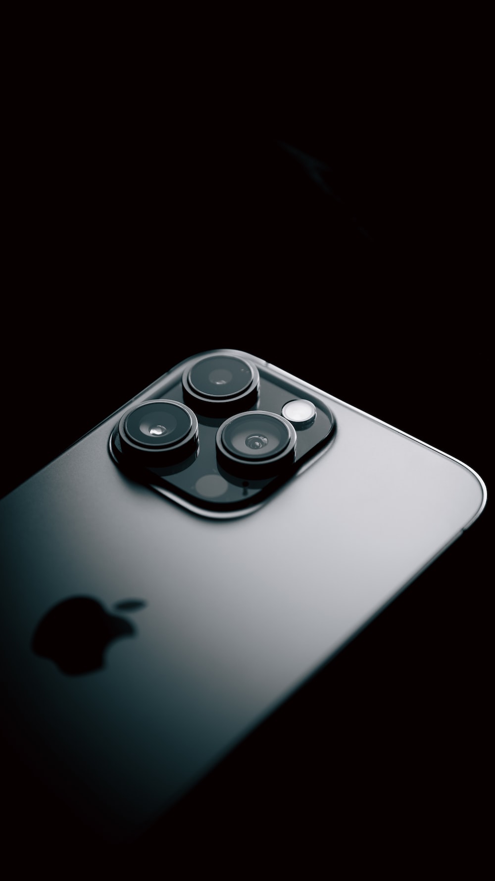 A close up of a cell phone with a black background photo