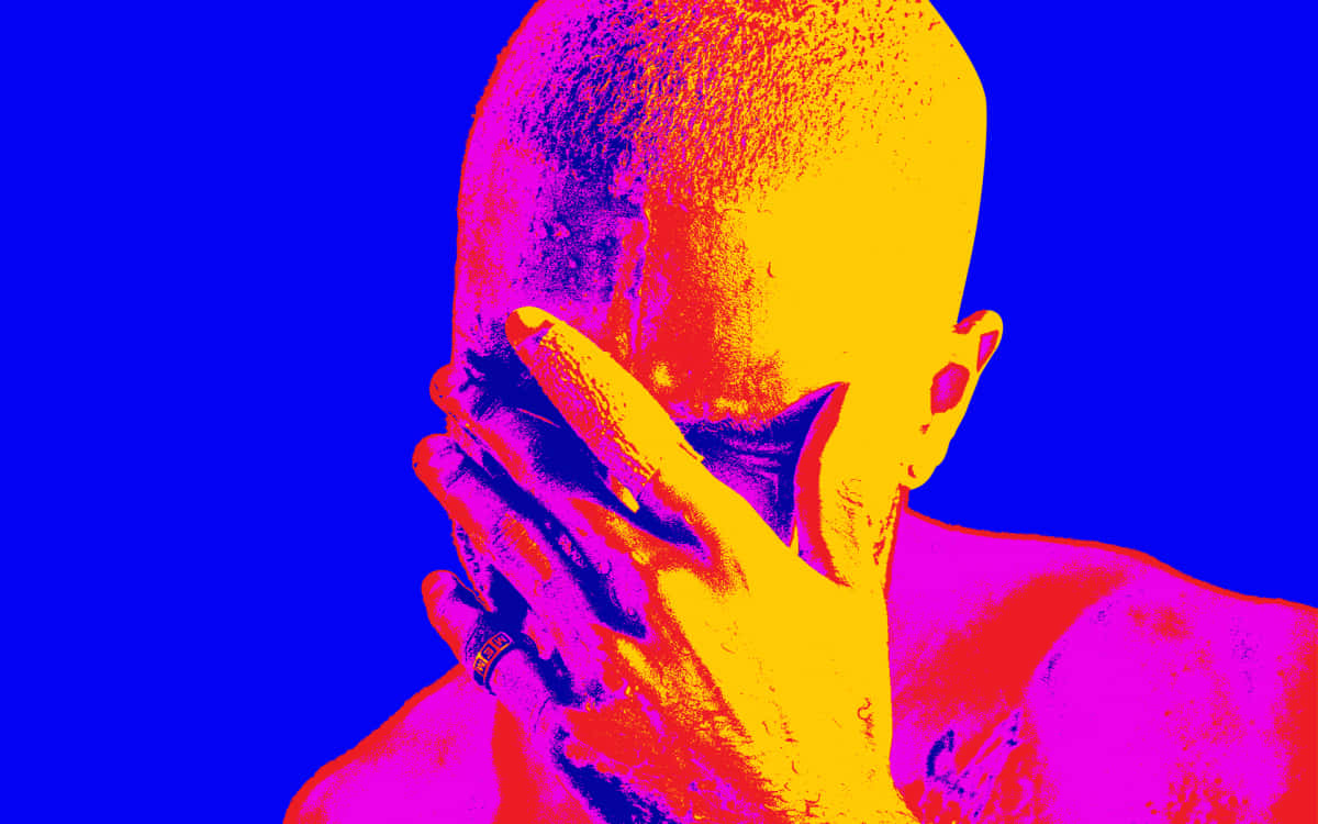 Download Frank Ocean standing in a studio with his laptop. Wallpaper