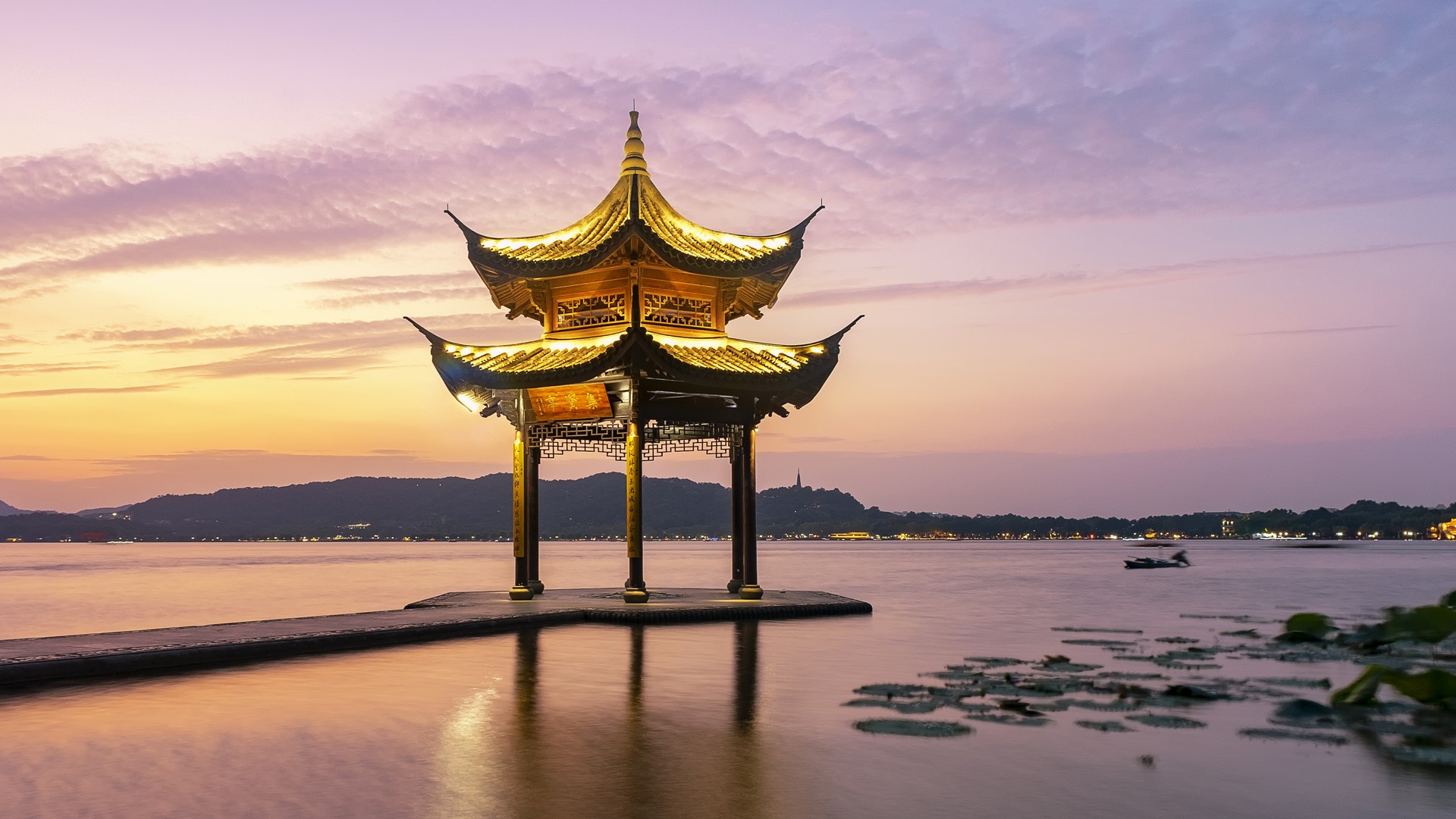 Hangzhou West Lake with Jixian Pavilion at sunset, China. Windows Spotlight Image