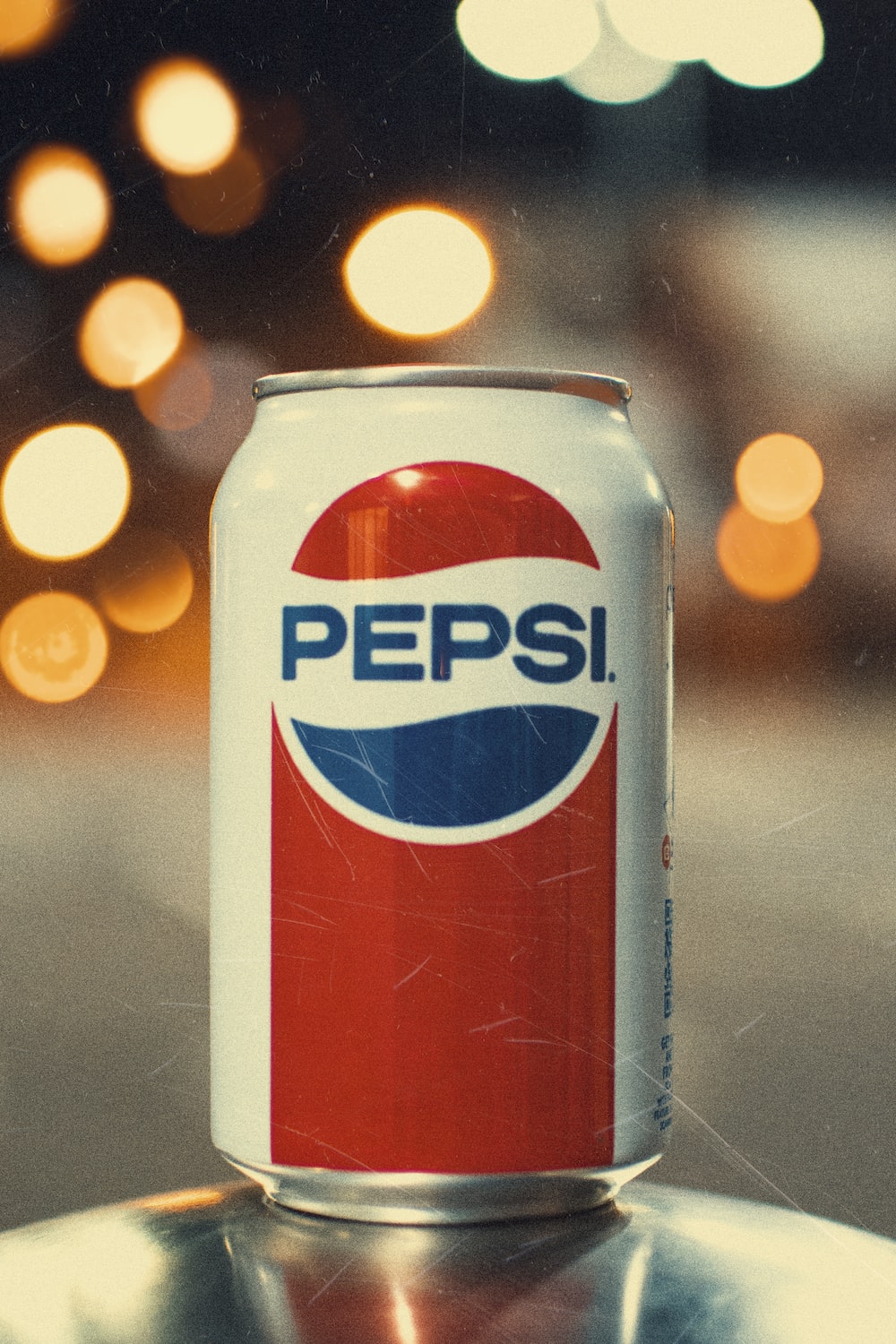 Pepsi can on gray surface photo