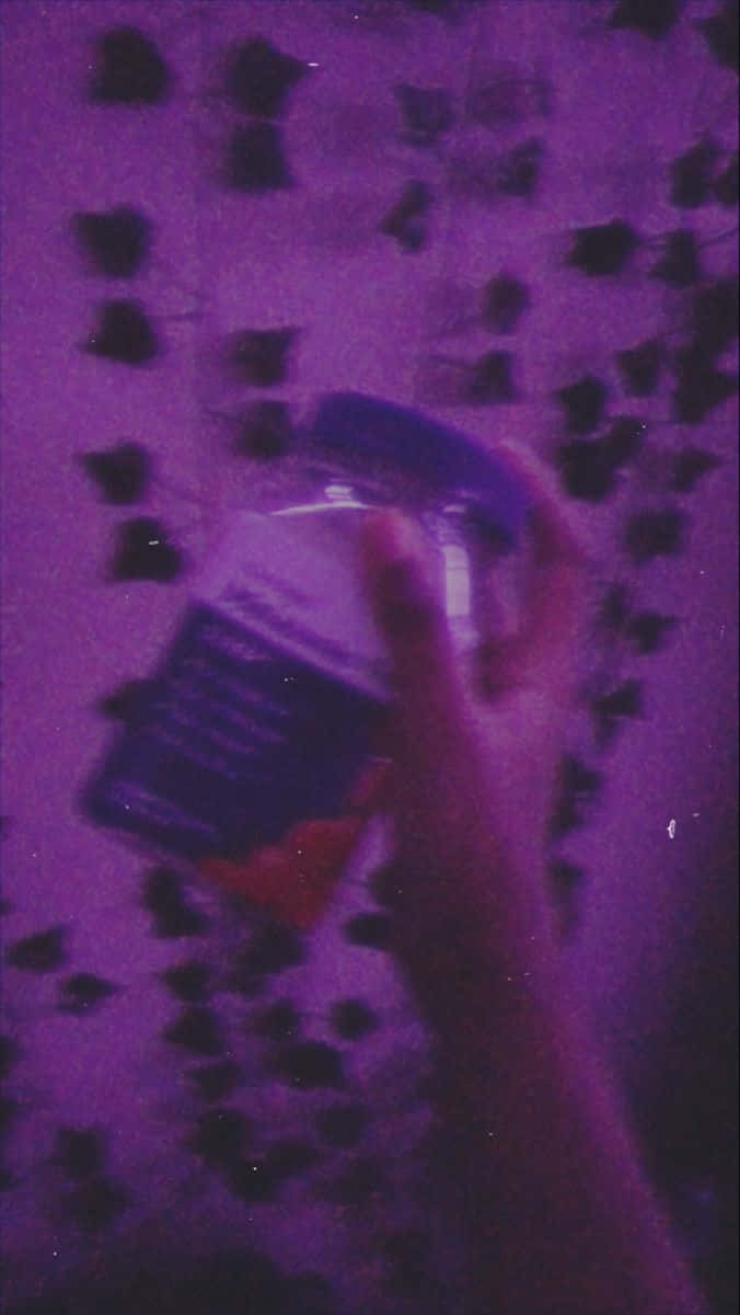 Download A Person Holding A Bottle Of Medicine Wallpaper