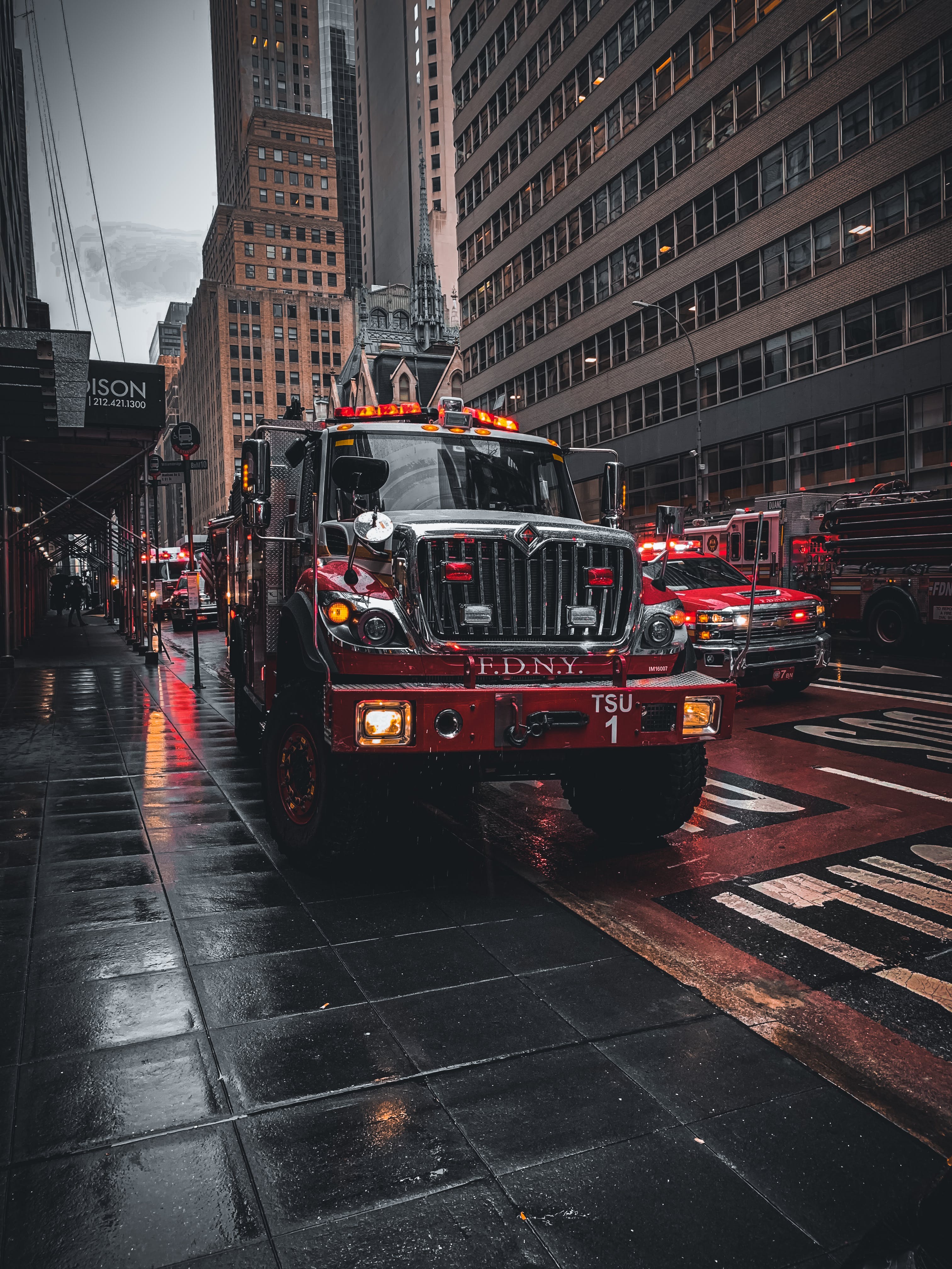Parked Fire Truck on Wet Pavement · Free
