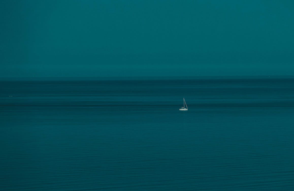 Small White Boat on Water · Free