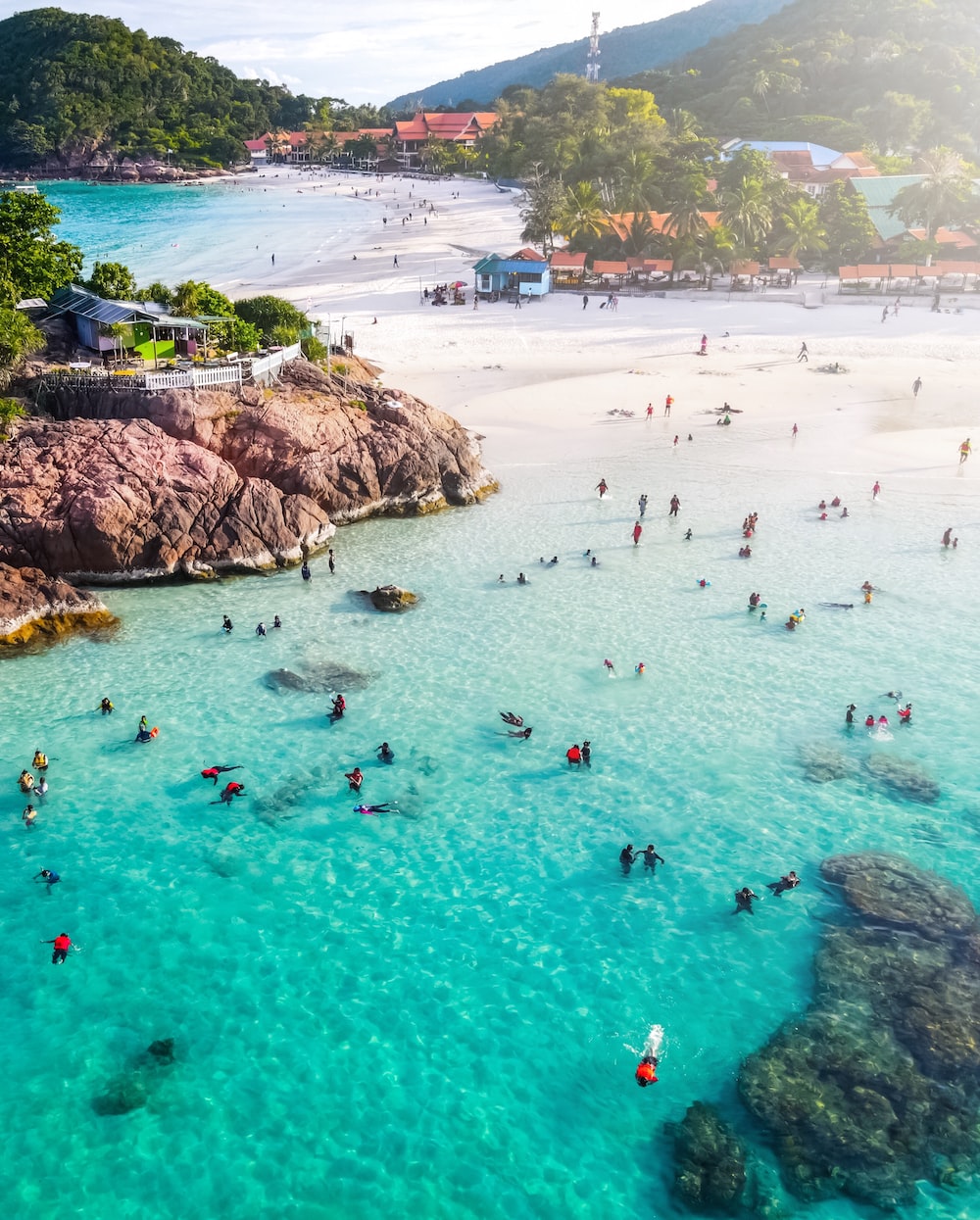 People on beach during daytime photo