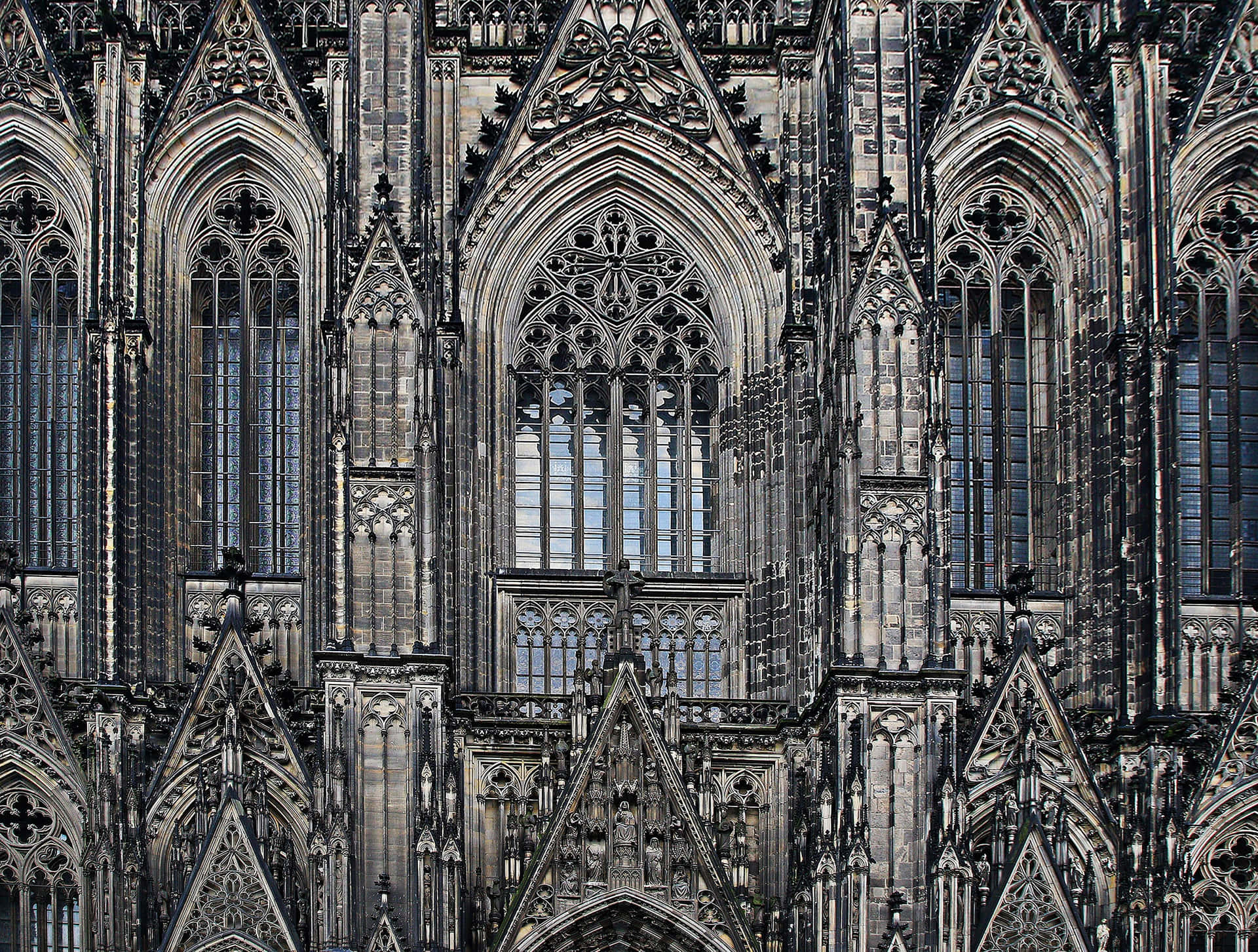 Download Majestic View of Cologne Cathedral with Gothic Architecture Wallpaper