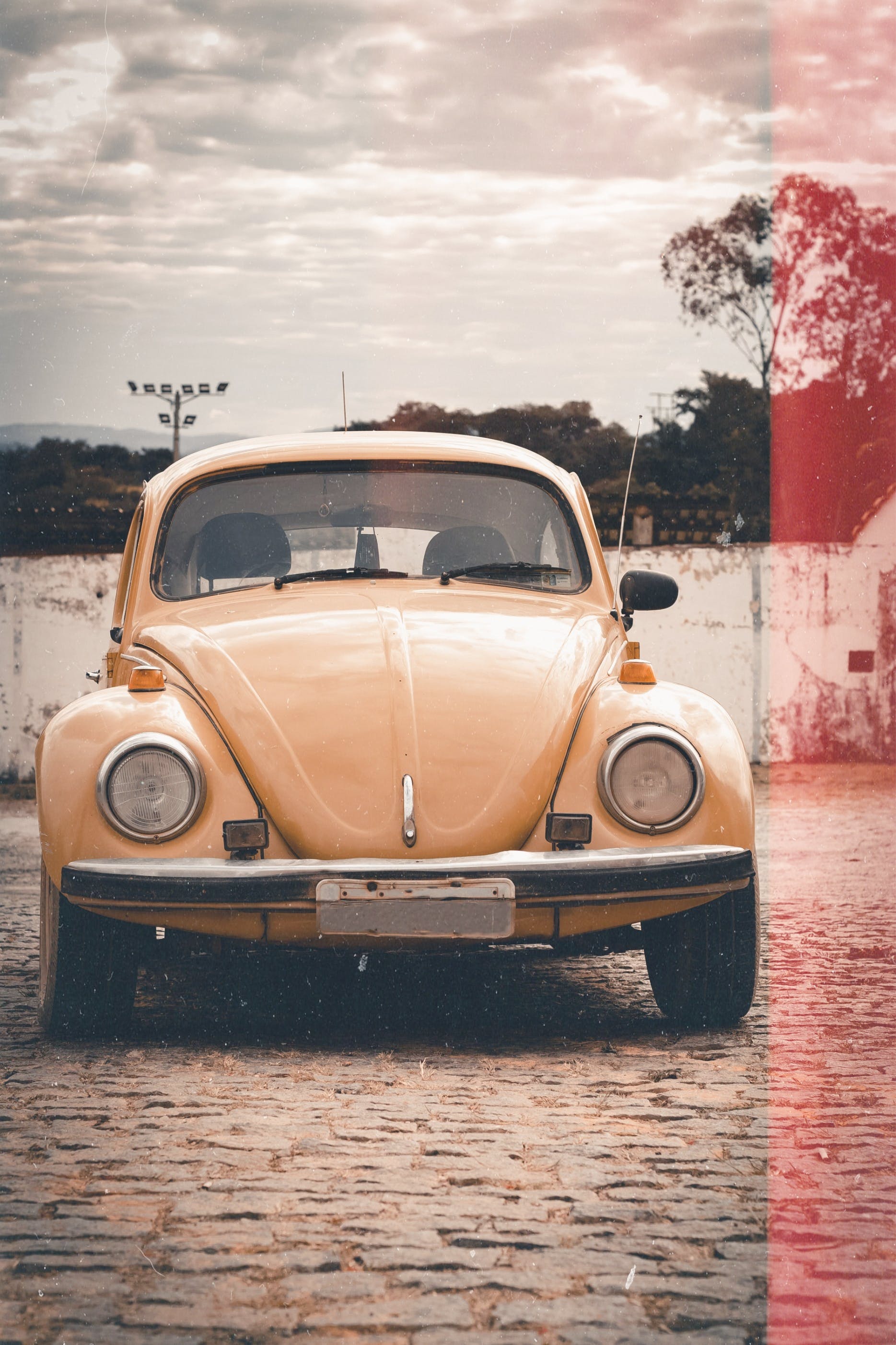 A Volkswagen Beetle on a Cobblestone Pavement · Free