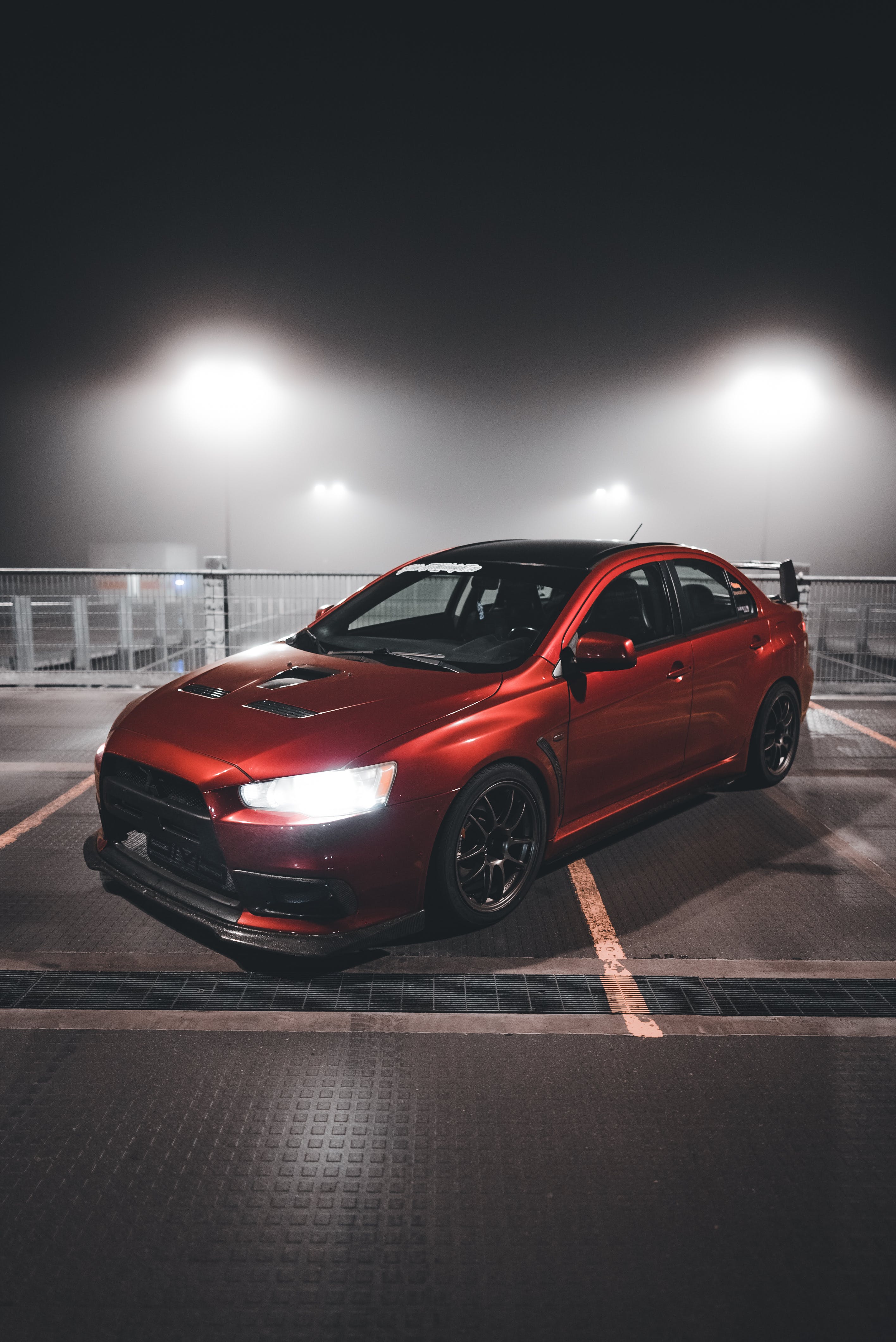 Mitsubishi Lancer Evolution on Parking Lot · Free