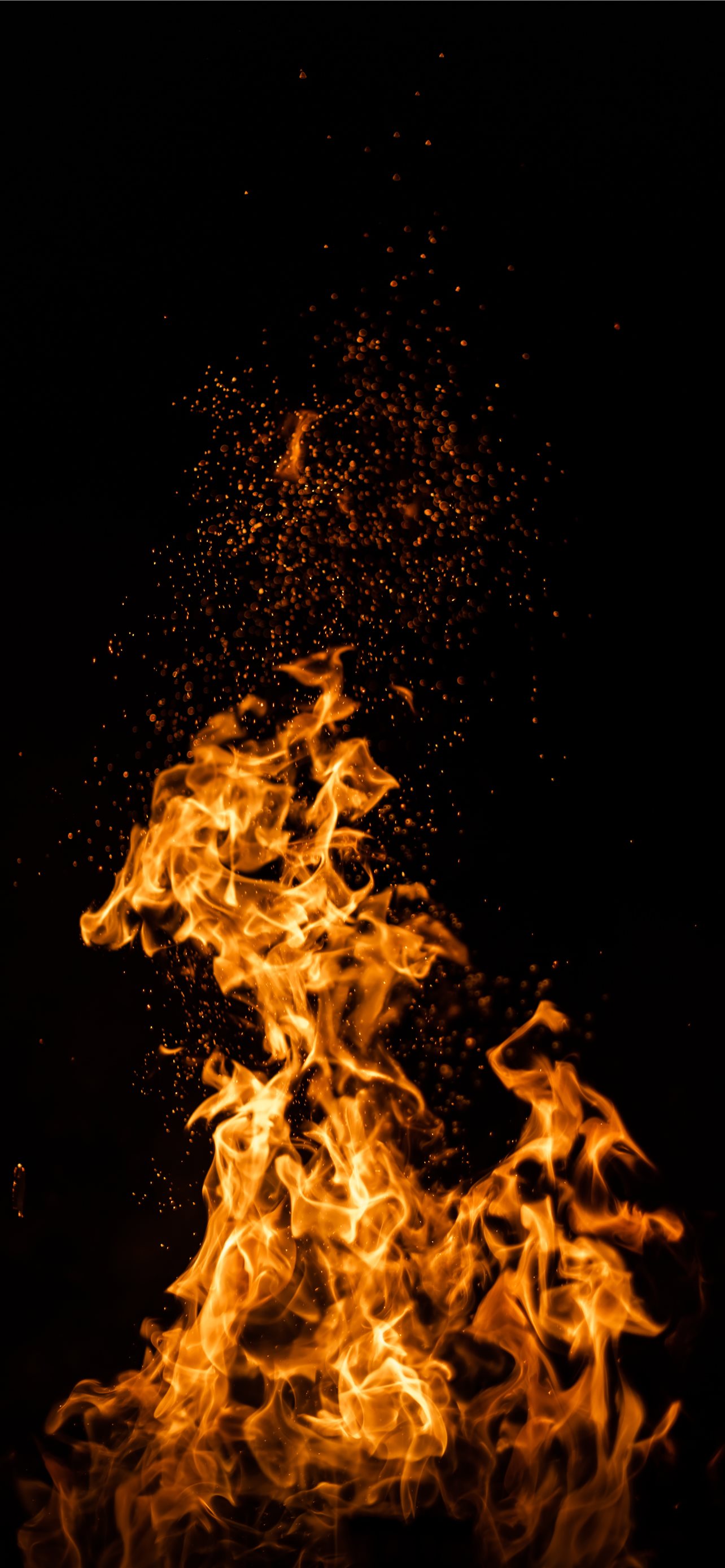 fire in the sky during night time iPhone Wallpaper Free Download