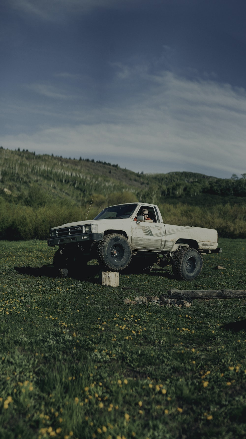 White Single Cab Pickup Truck On Grass Field Photo