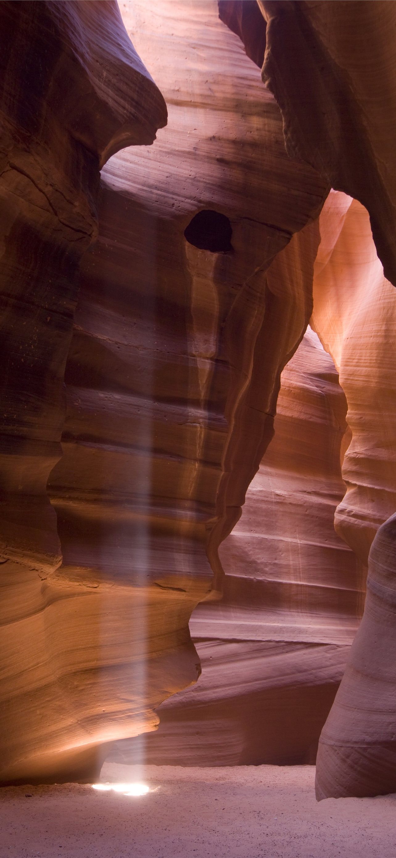 Inside a sandstone cave in the desert of Antelope. iPhone Wallpaper Free Download