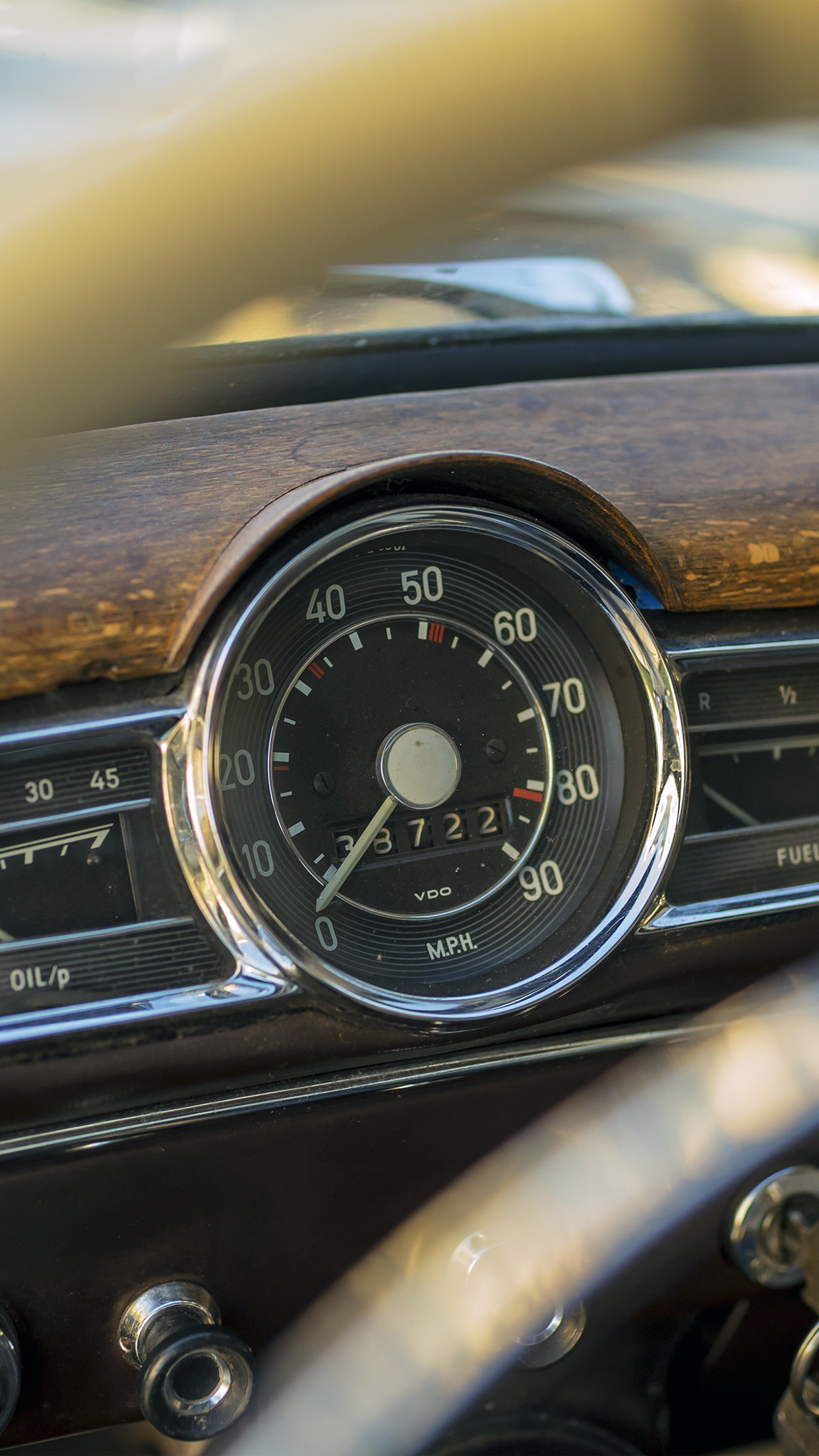 iPhone X wallpaper. driver seat car vintage bokeh