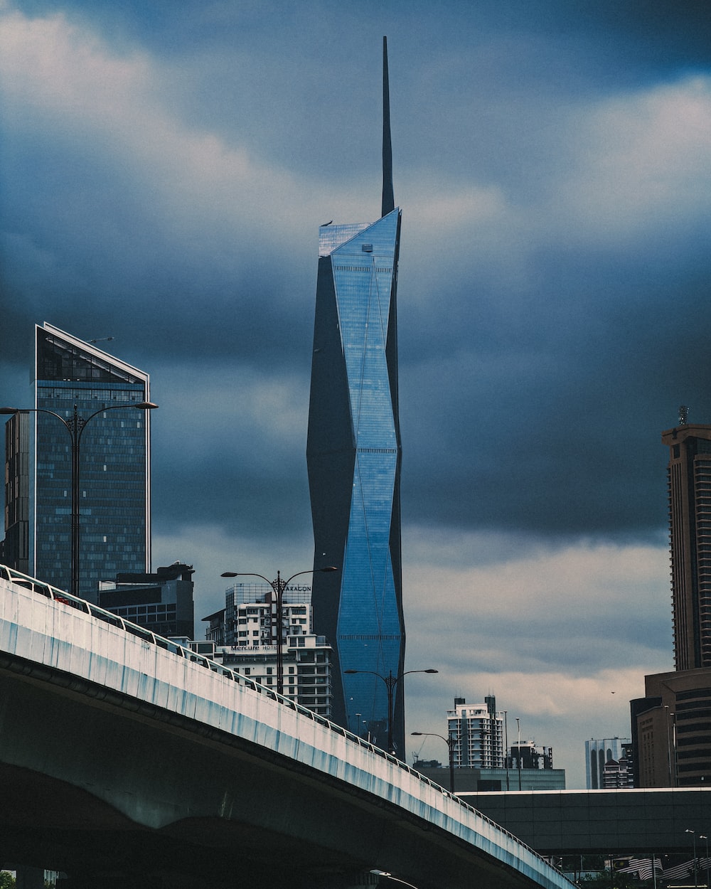 A very tall building towering over a city photo