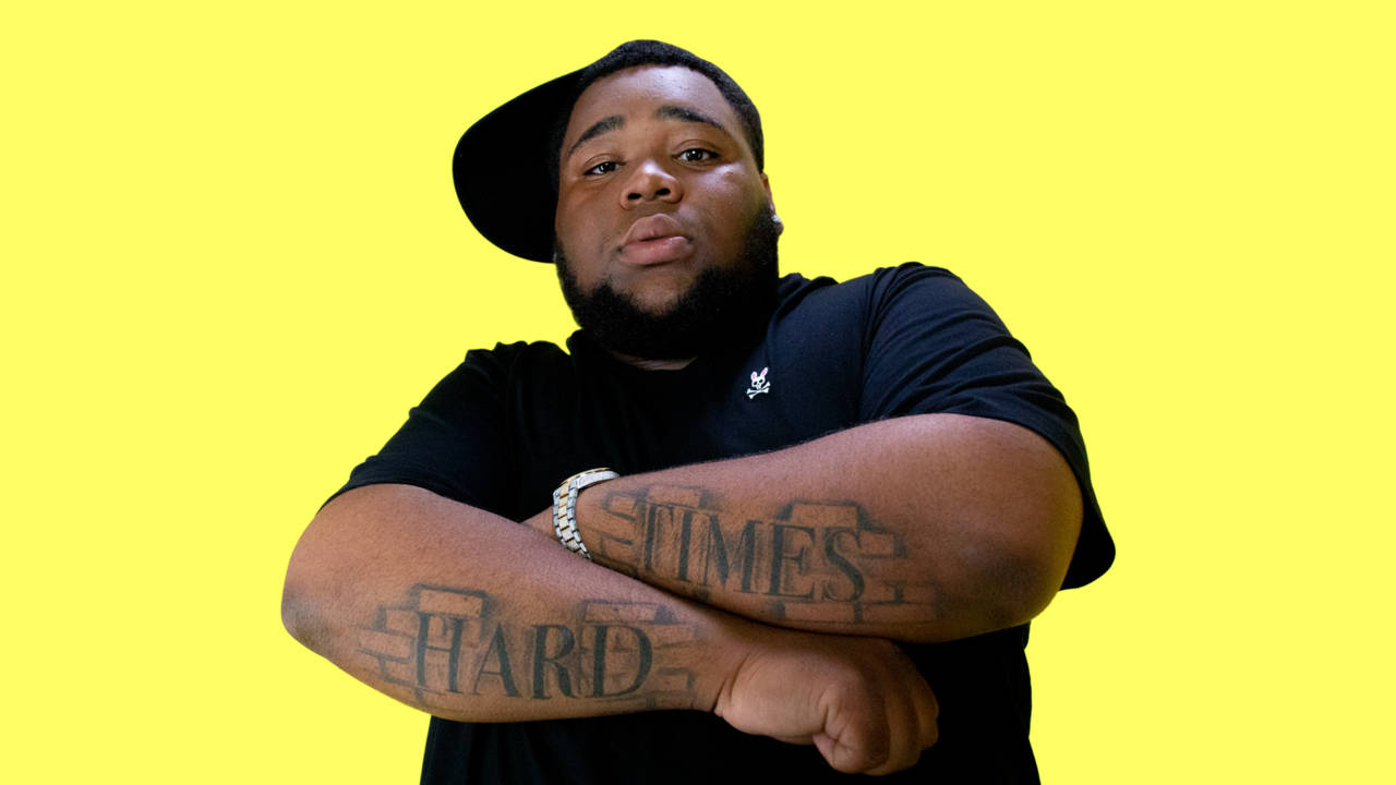 Download Rod Wave In Yellow Wallpaper