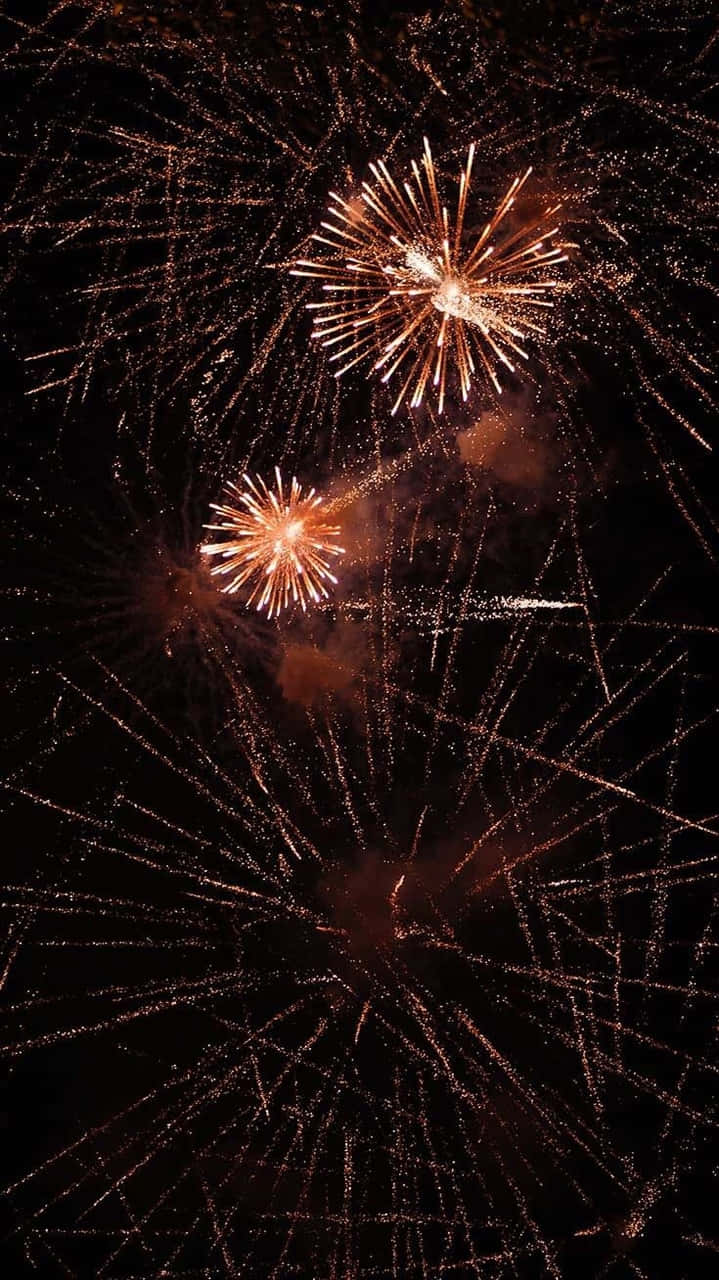 Download Fireworks In The Sky With A Black Background Wallpaper
