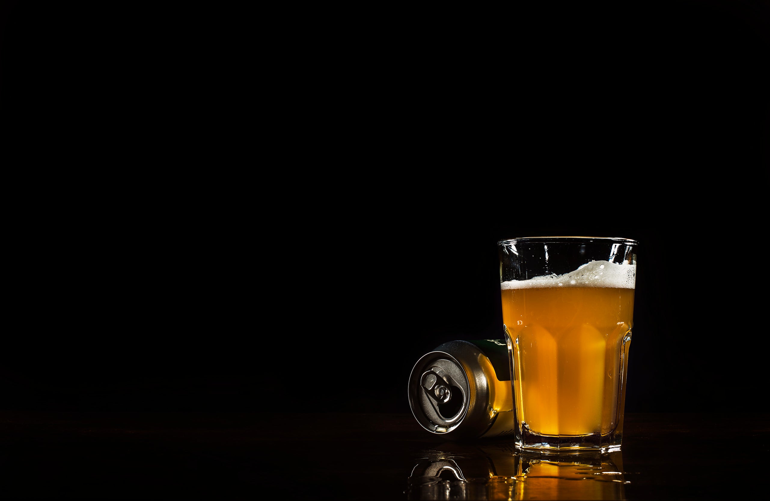 Browse Free HD Image of Beer Can And Glass With Spill Reflection