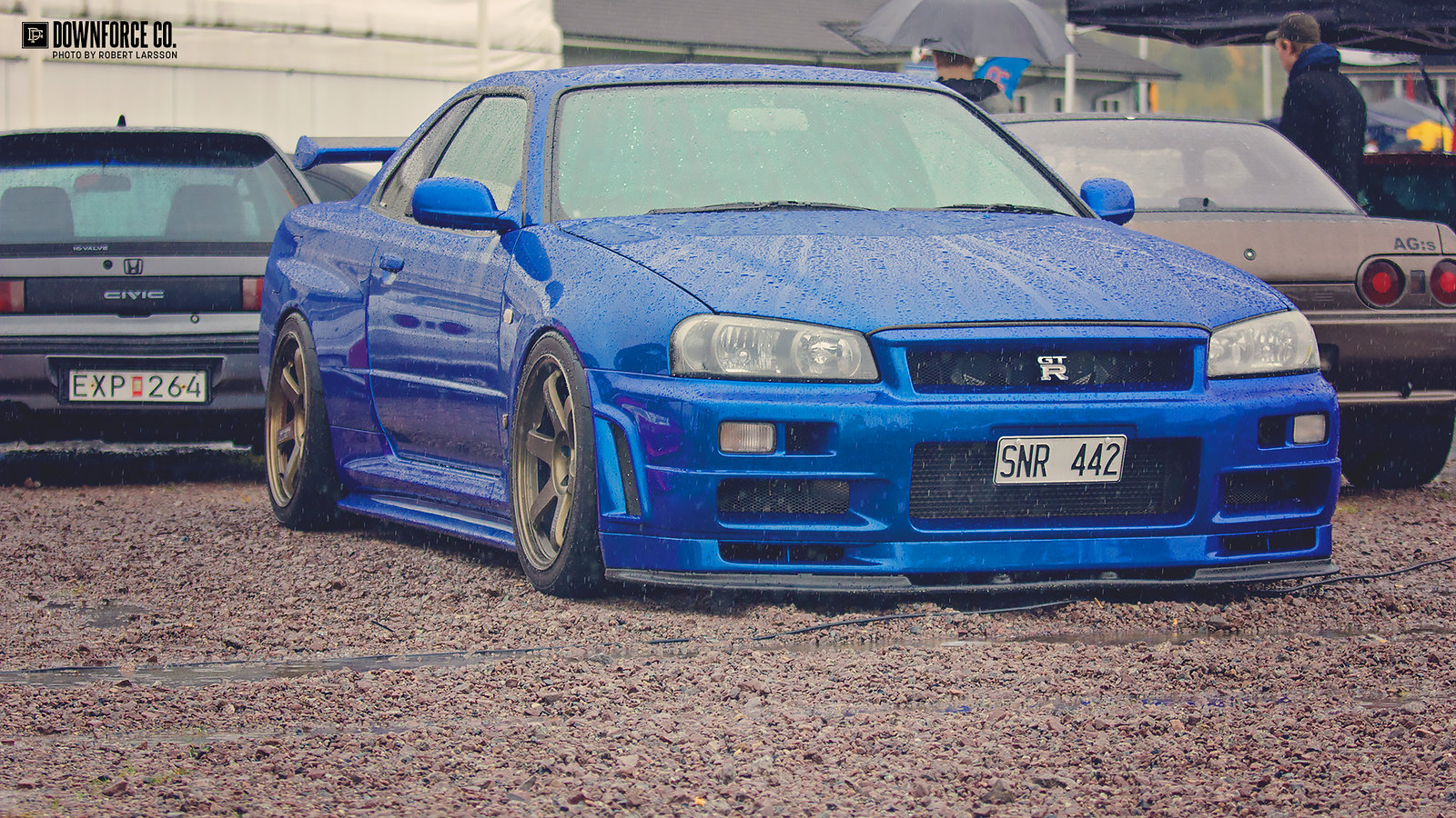 Godzilla In The Rain. Bayside Blue R34 GT R On Bronze TE37