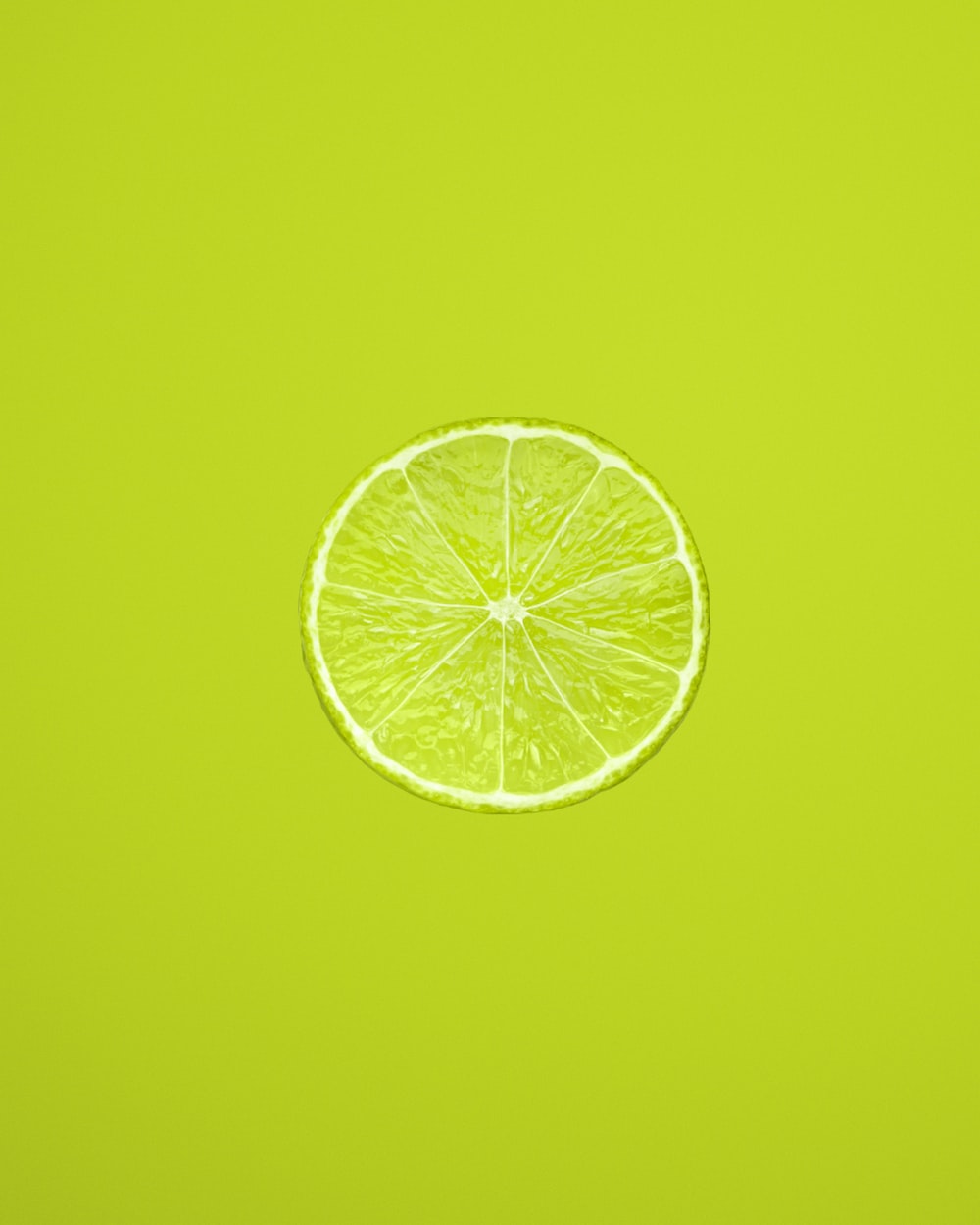 Yellow lemon fruit on green background photo