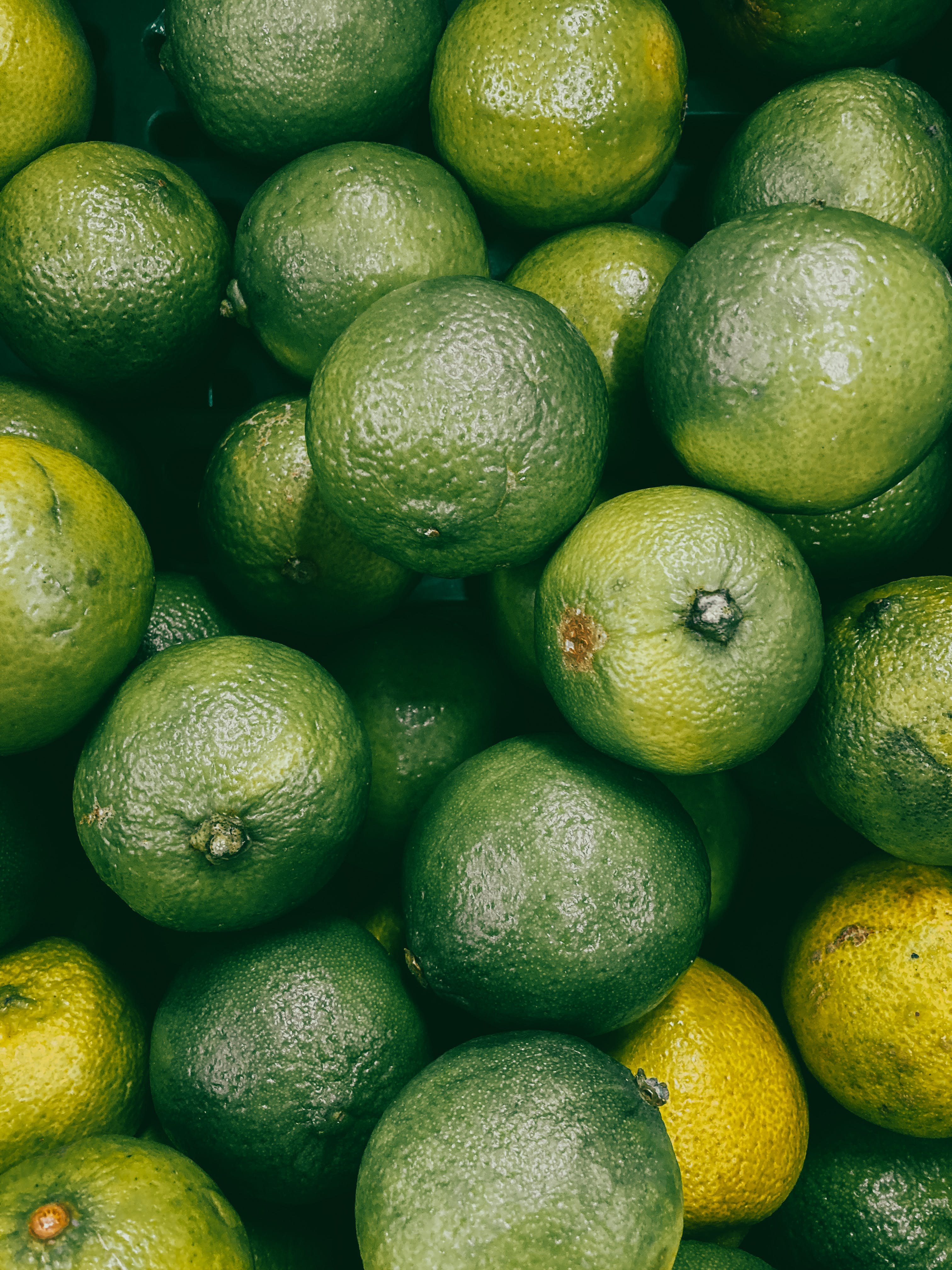 Green Lemon Fruit on White Surface · Free