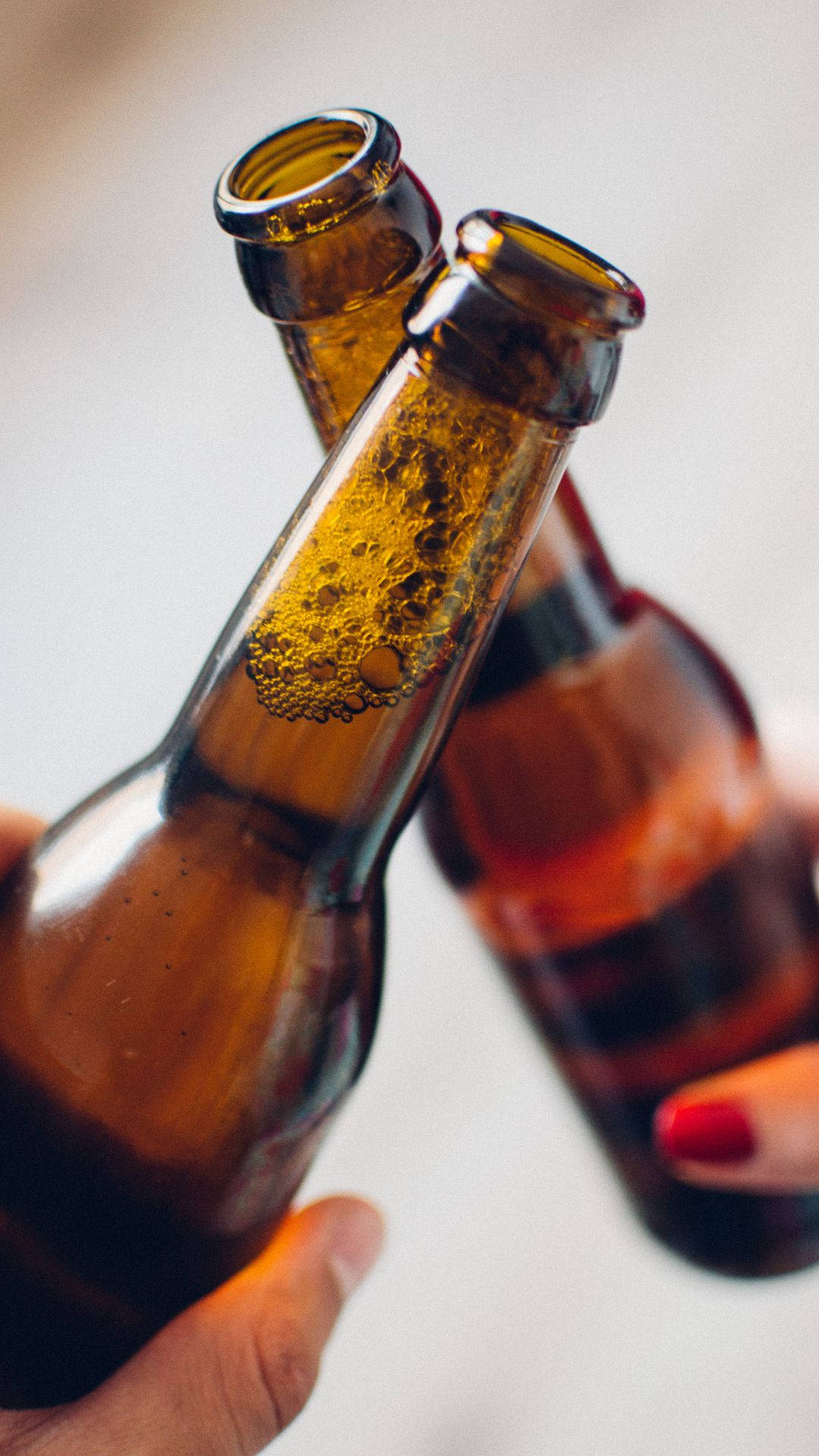 Download Clinking Bottles Of Alcohol Wallpaper