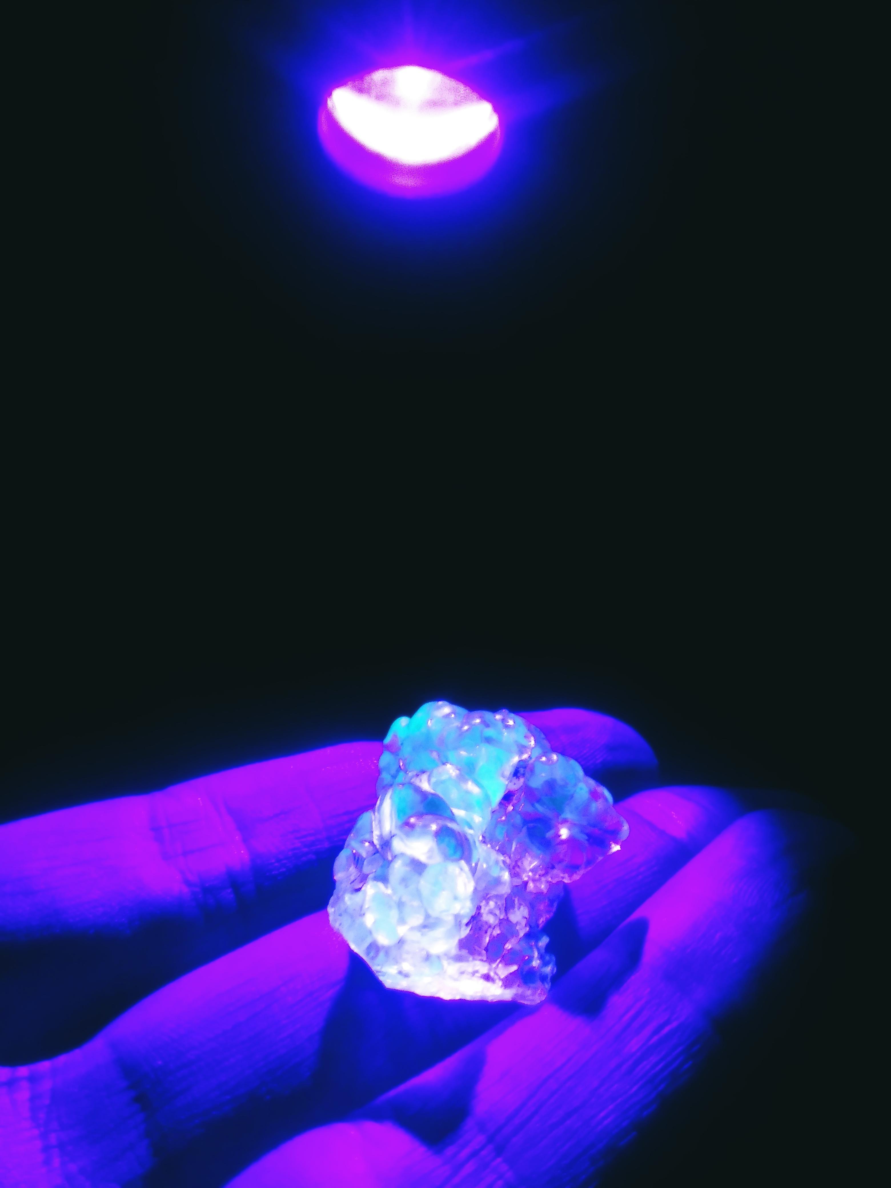 This is how tiny amounts of radioactive Uranium look like under UV light! I also grew a third hand after this