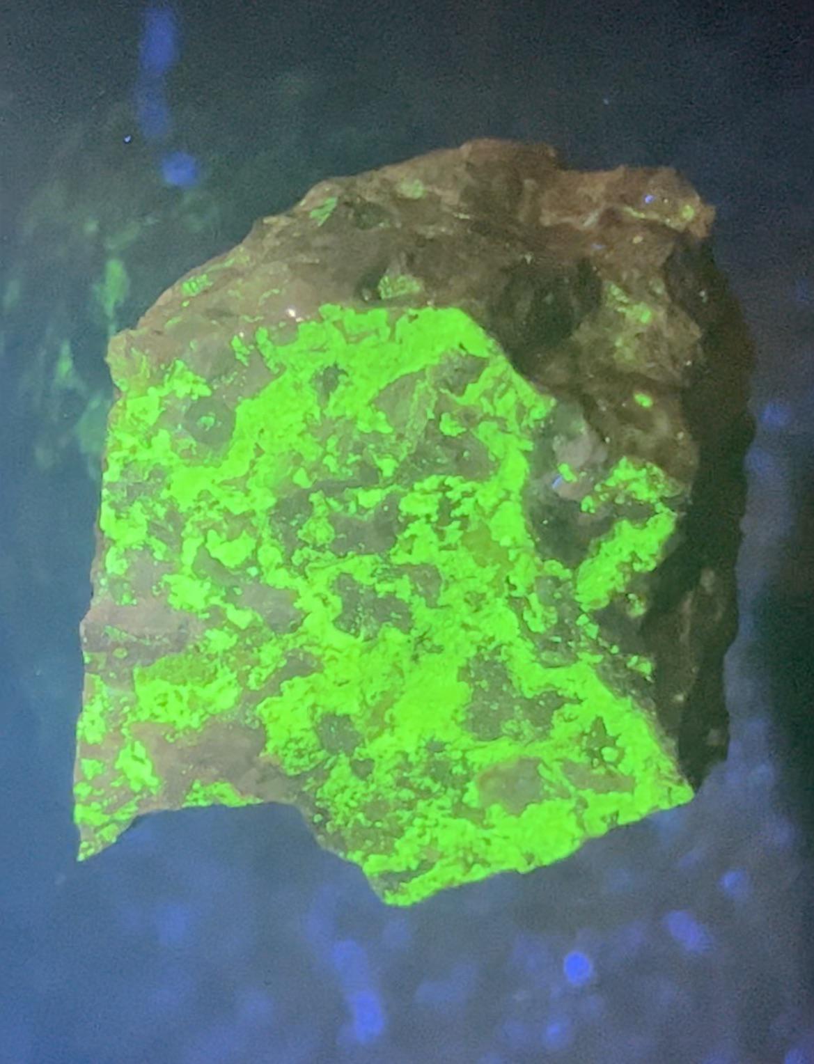 Radioactive Uranium Ore Glowing Under Blacklight