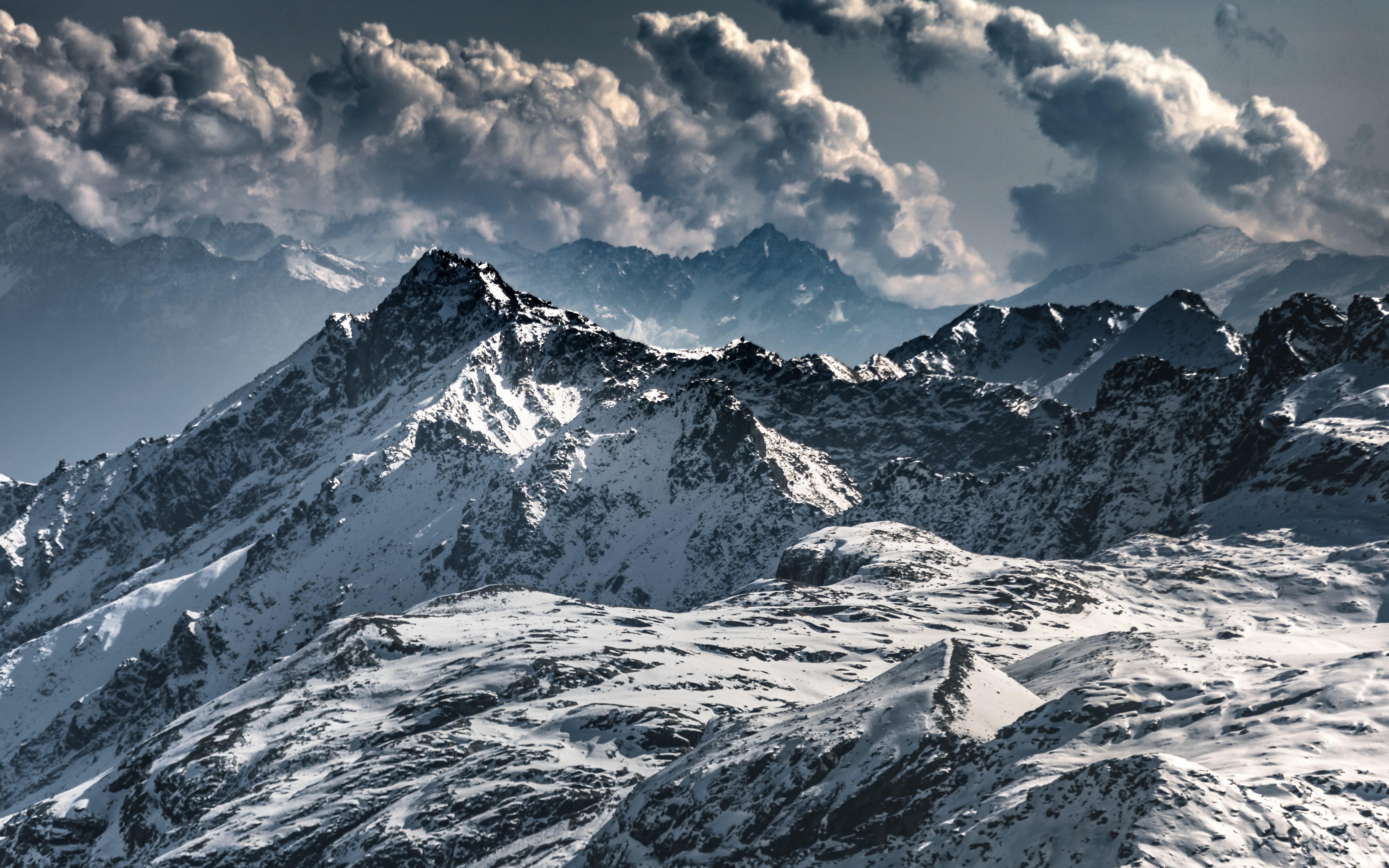 Snow Covered Mountain Under Cloudy Sky
